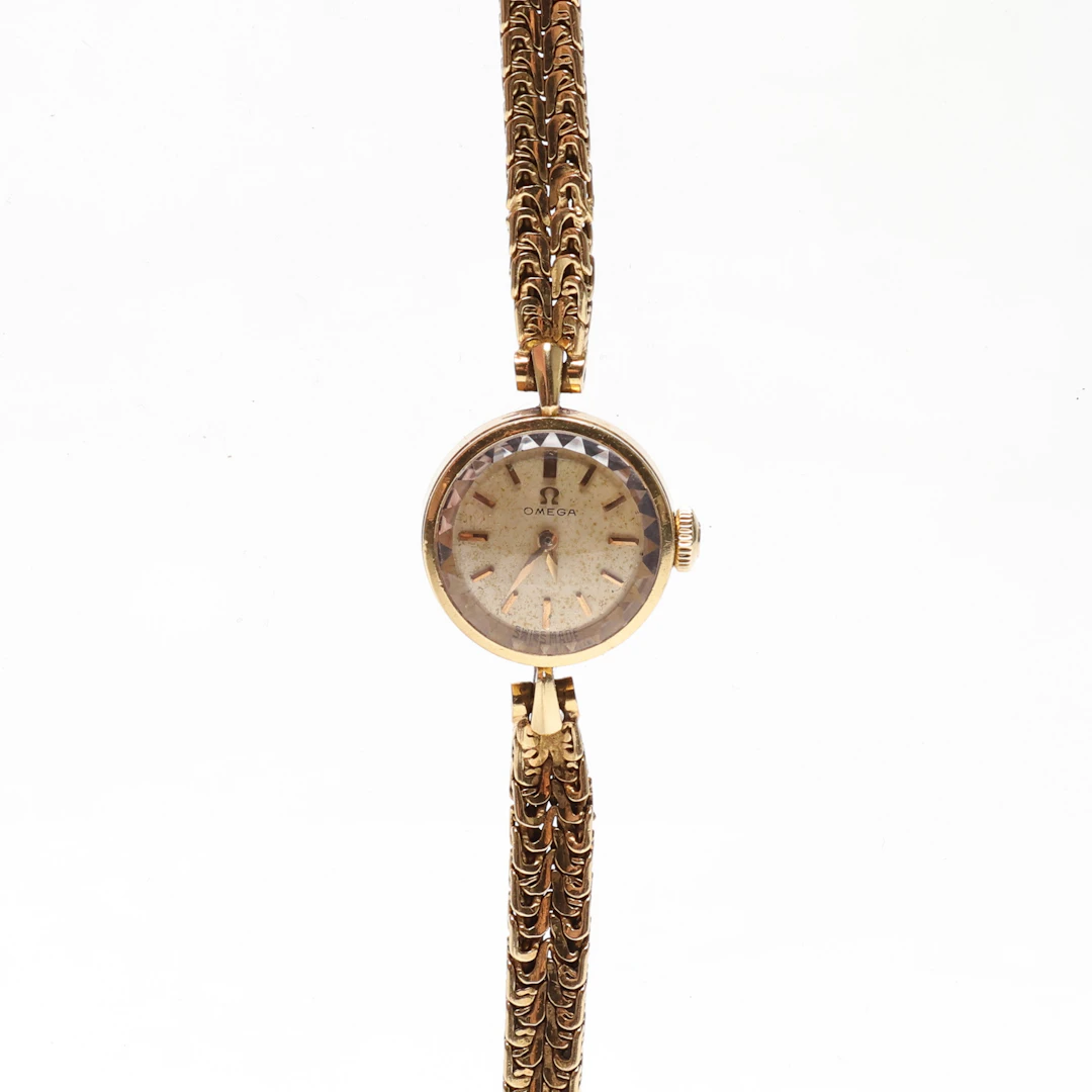 DAMARBANDSUR, manuell. Omega, 18K guld i boett och armband. totalvikt