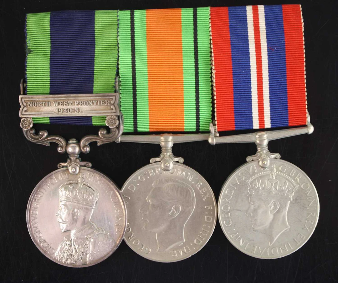 Lot 1098 - A group of three medals to include an India
