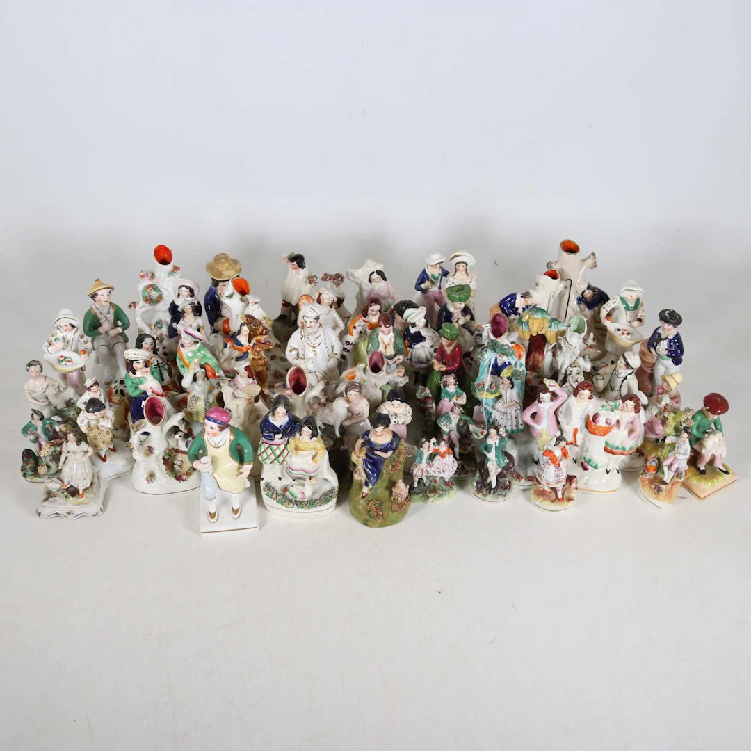Lot 124 - A collection of Staffordshire figures, to