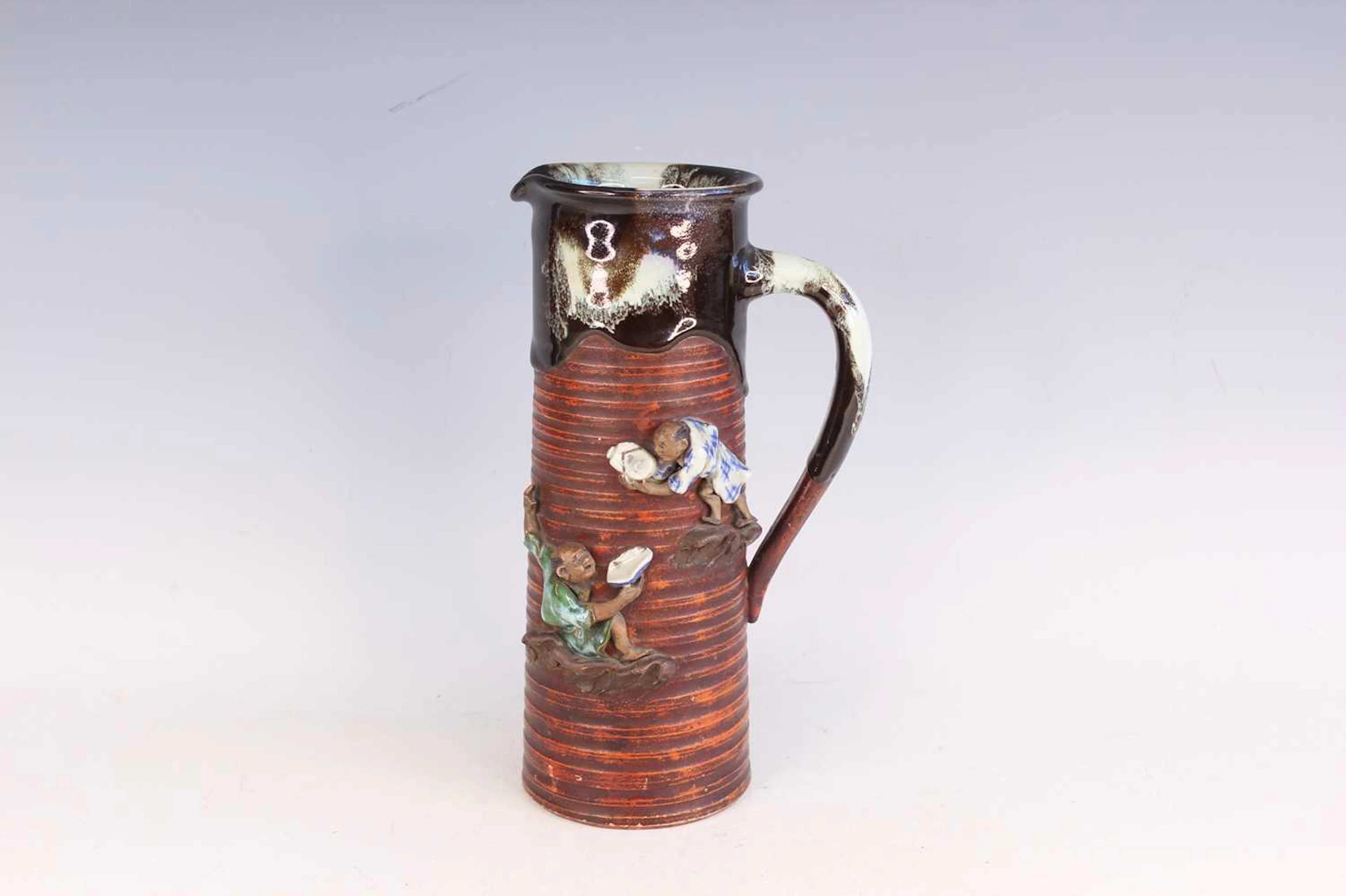Lot 199 - A Japanese Sumida Gawa pottery tankard