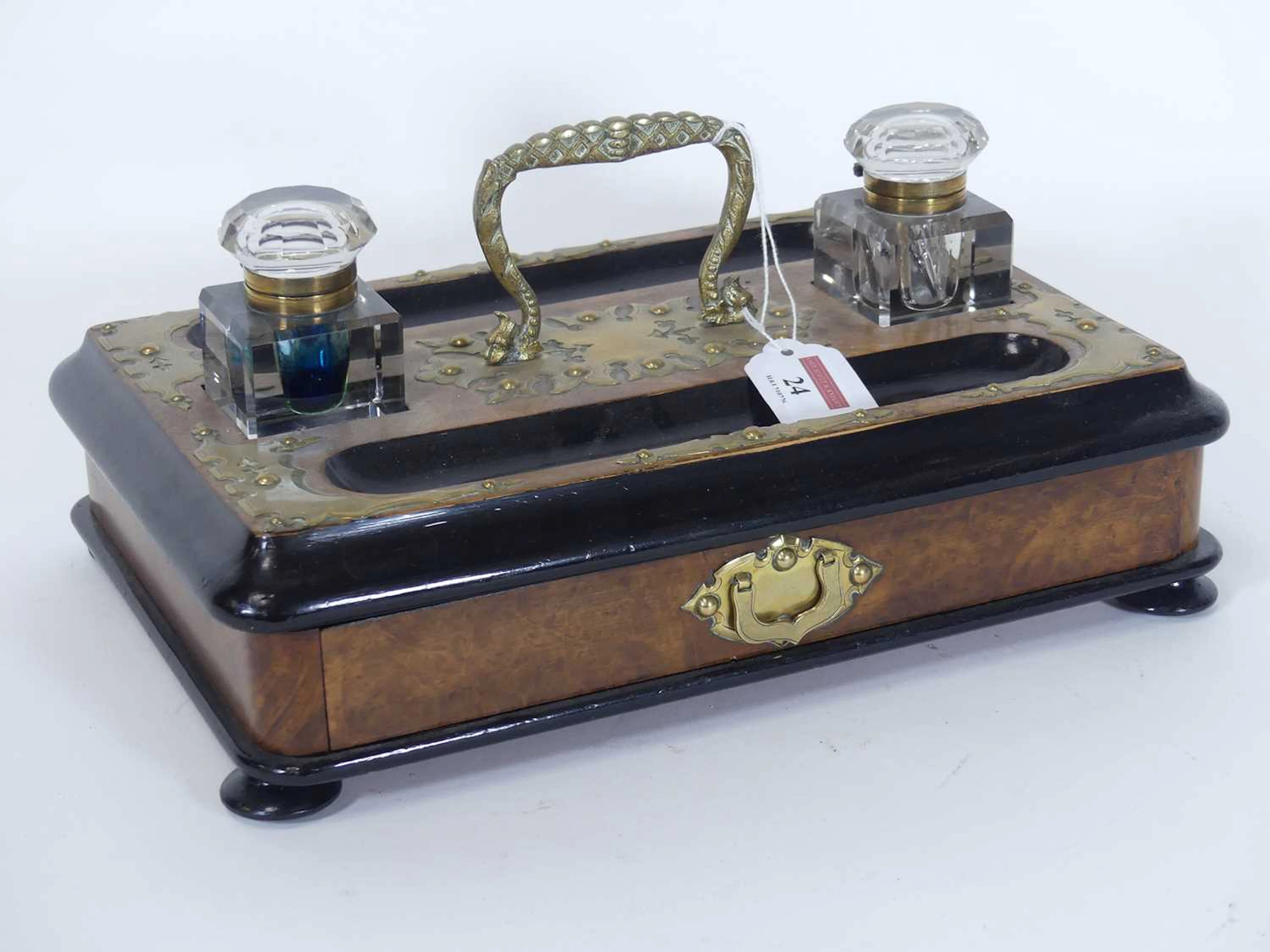 Lot 24 - A Victorian walnut parcel ebonised and brass