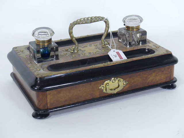 Lot 24 - A Victorian walnut parcel ebonised and brass