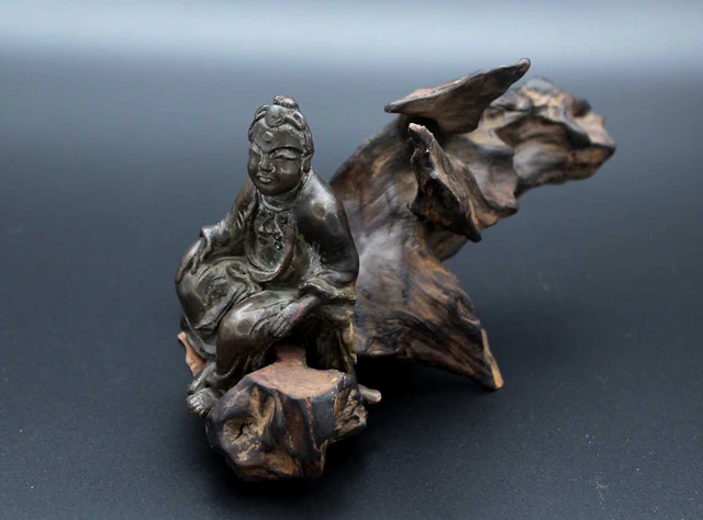 Lot 33 - A Chinese bronze figure of an immortal riding
