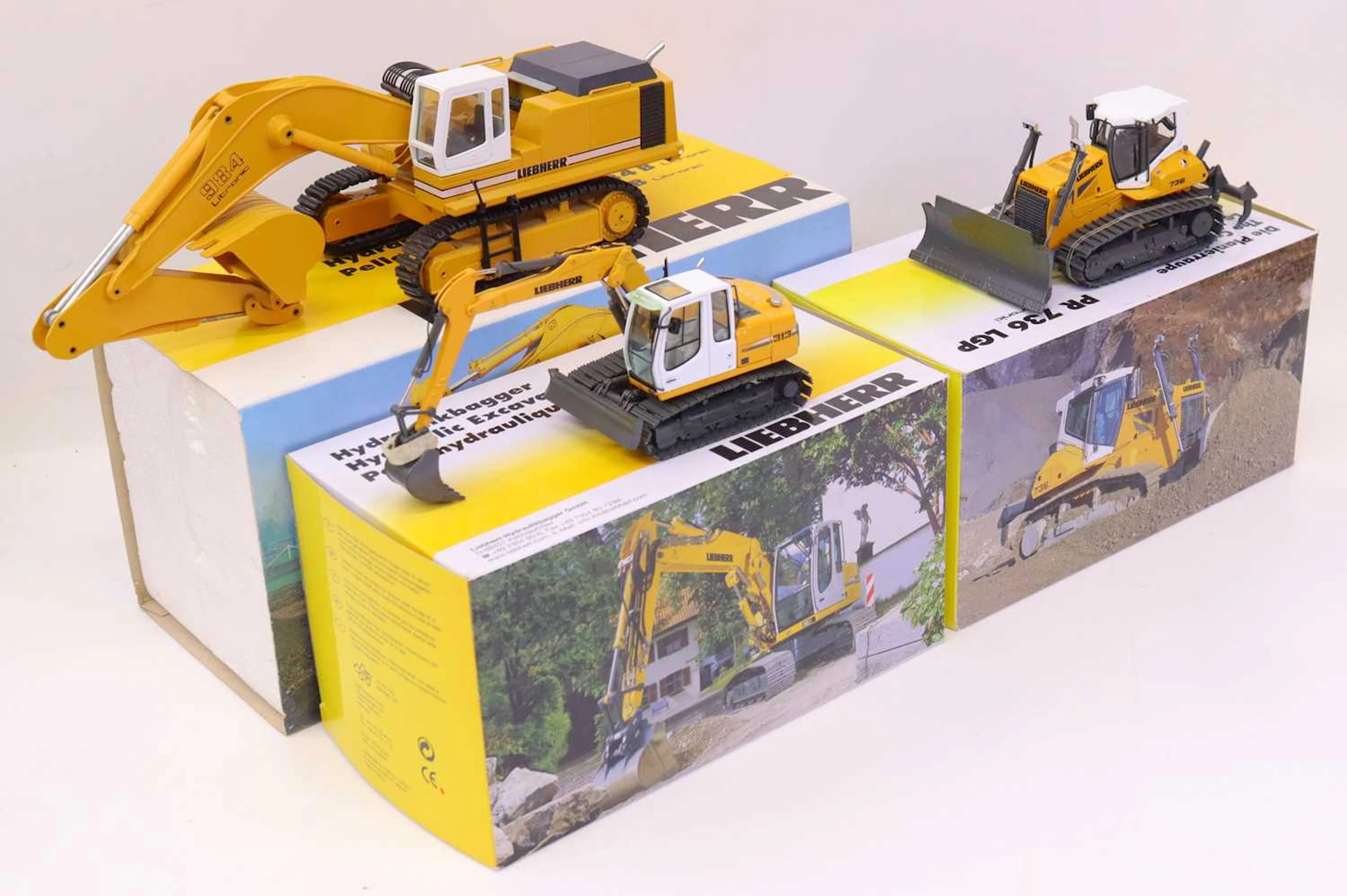 Lot 473 - Three various boxed NZG and Conrad 1/50