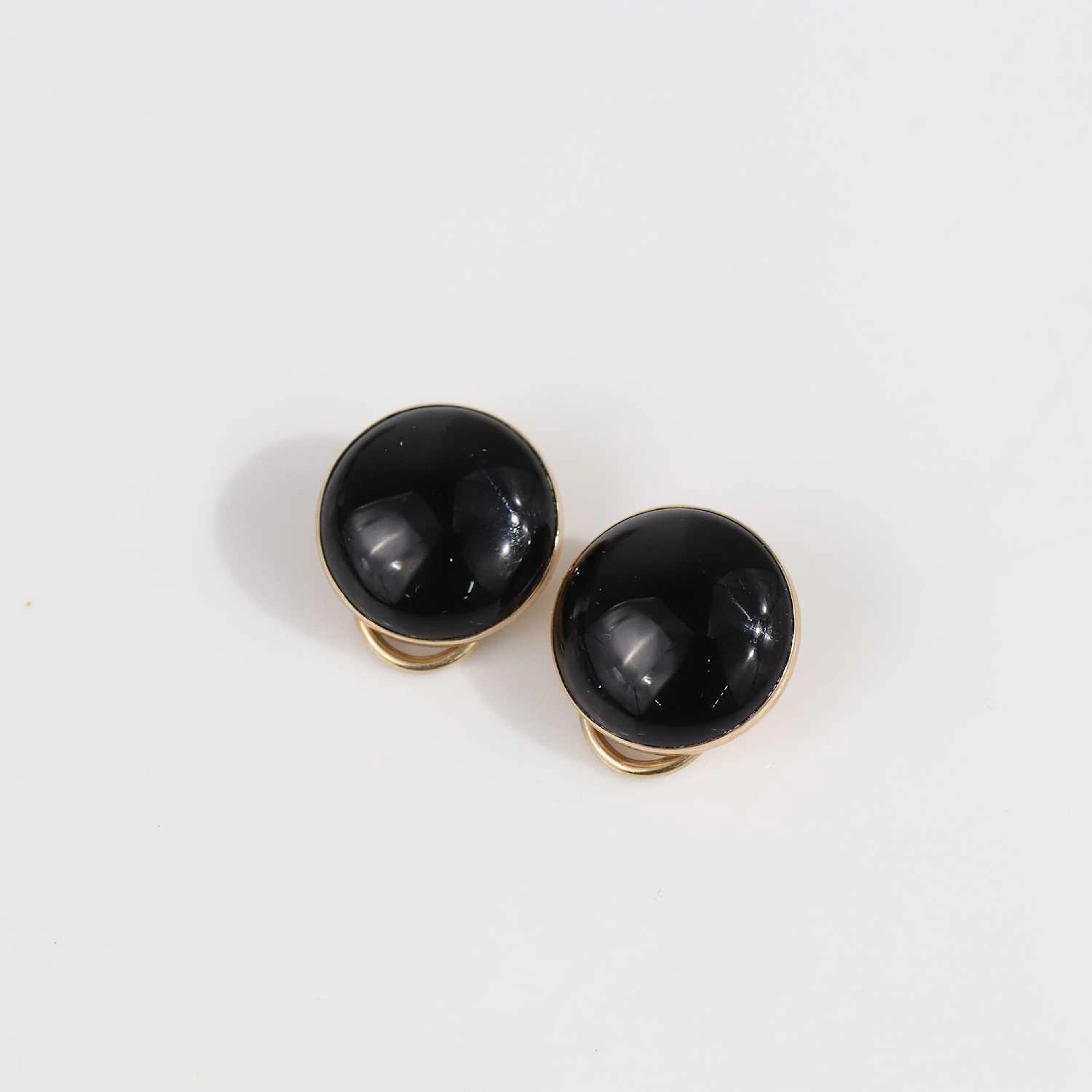Lot 350 - A pair of 9ct gold-backed and cabochon onyx