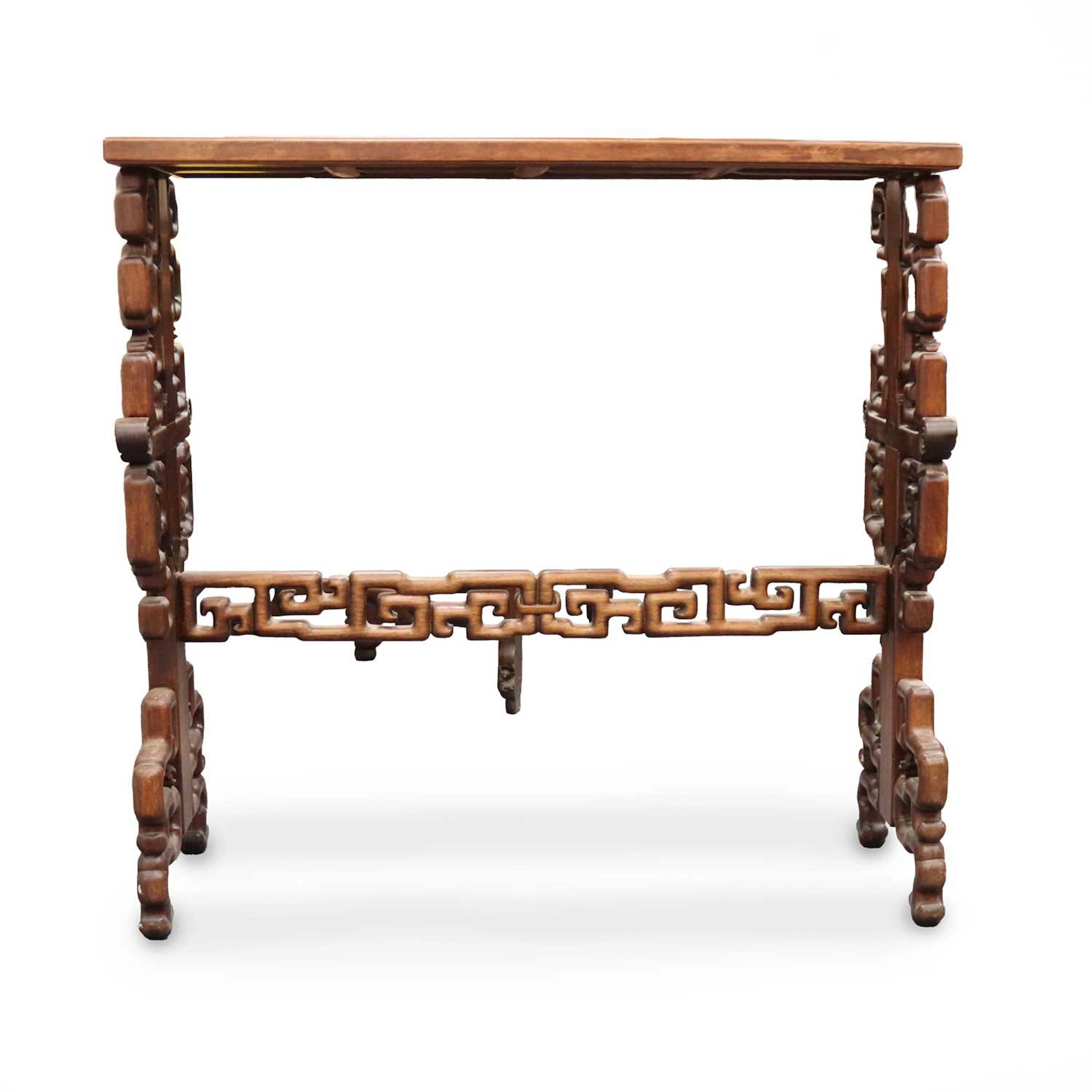 Lot 184 - A Chinese carved hardwood rectangular side