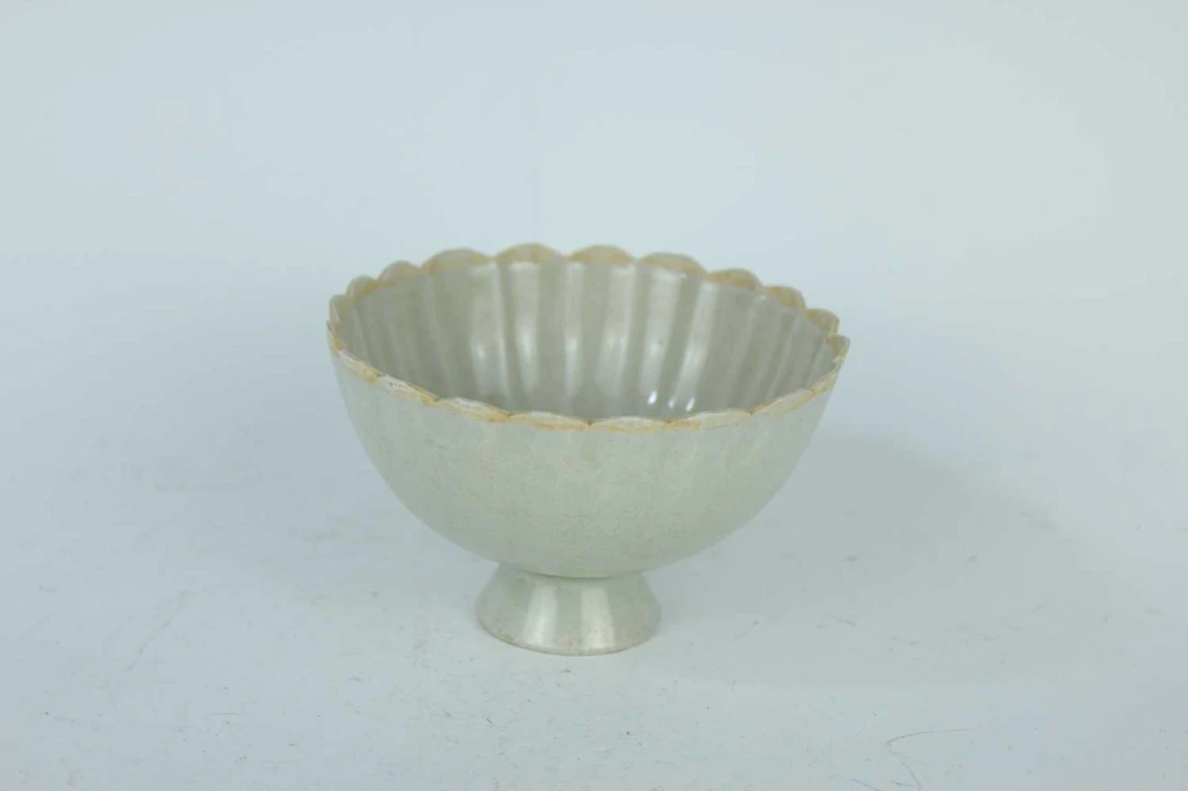 Lot 59 - A Chinese white-glazed lotus bowl, Song