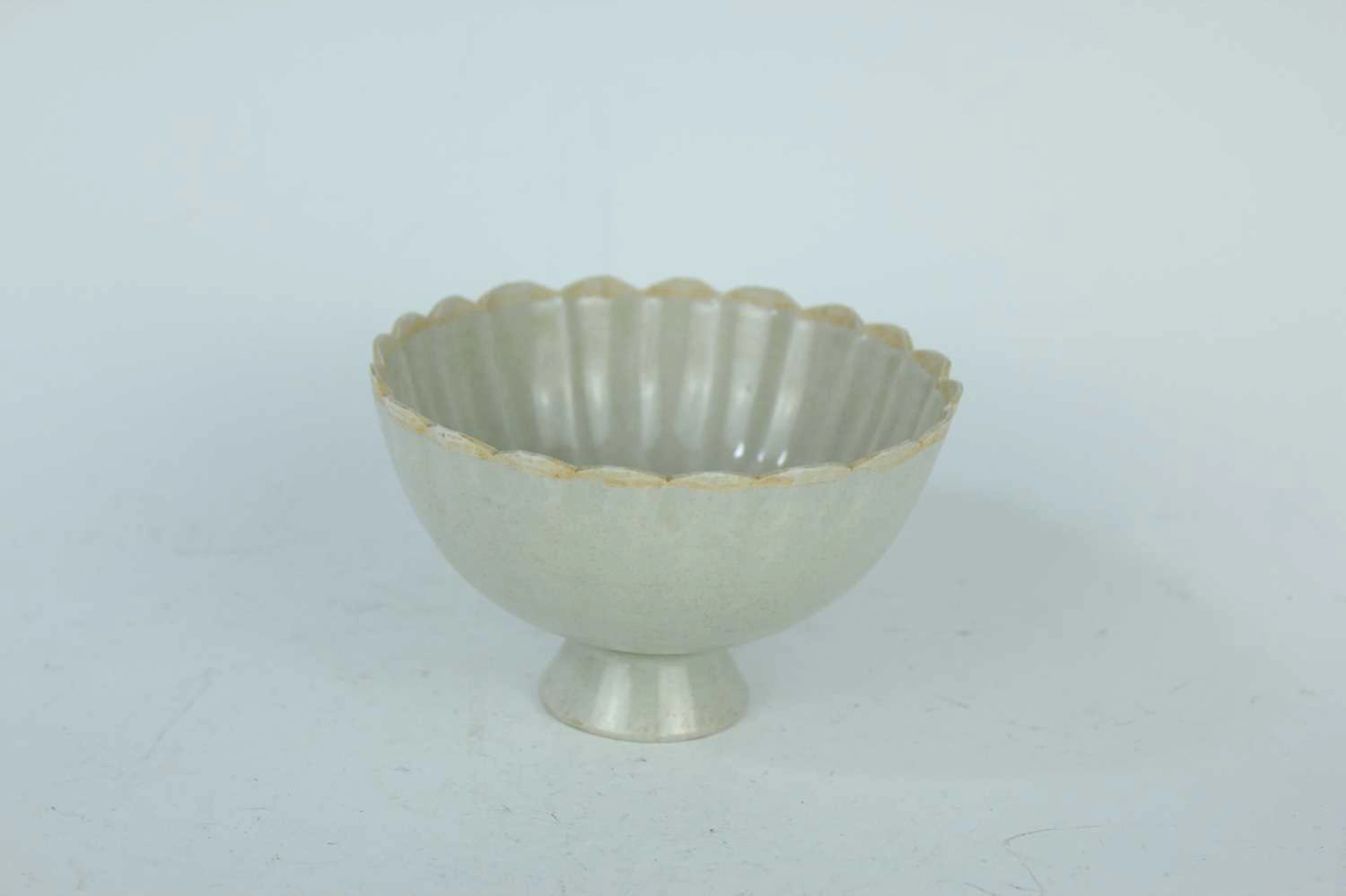 Lot 59 - A Chinese white-glazed lotus bowl, Song