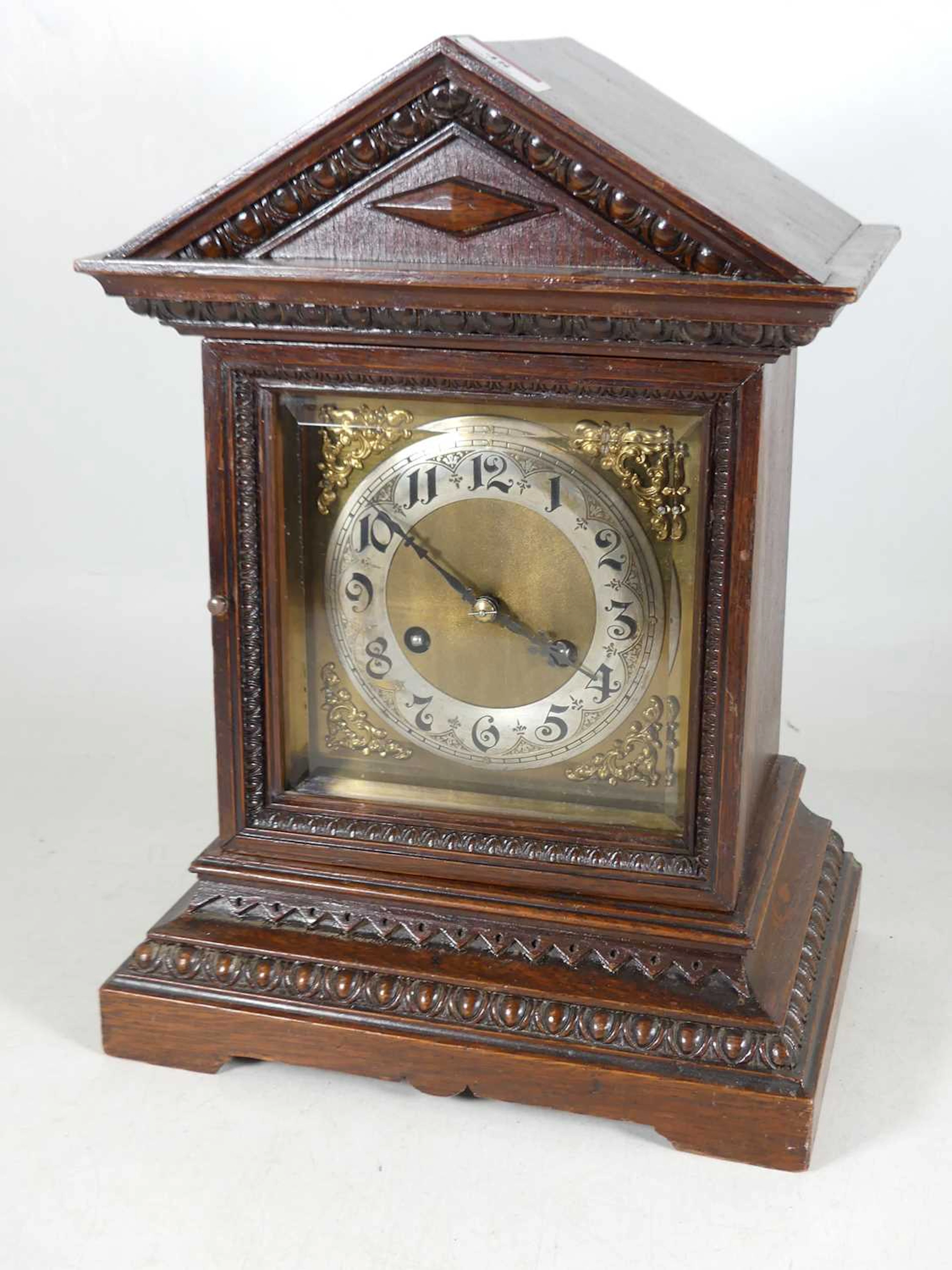 Lot 48 - A continental oak cased mantel clock of