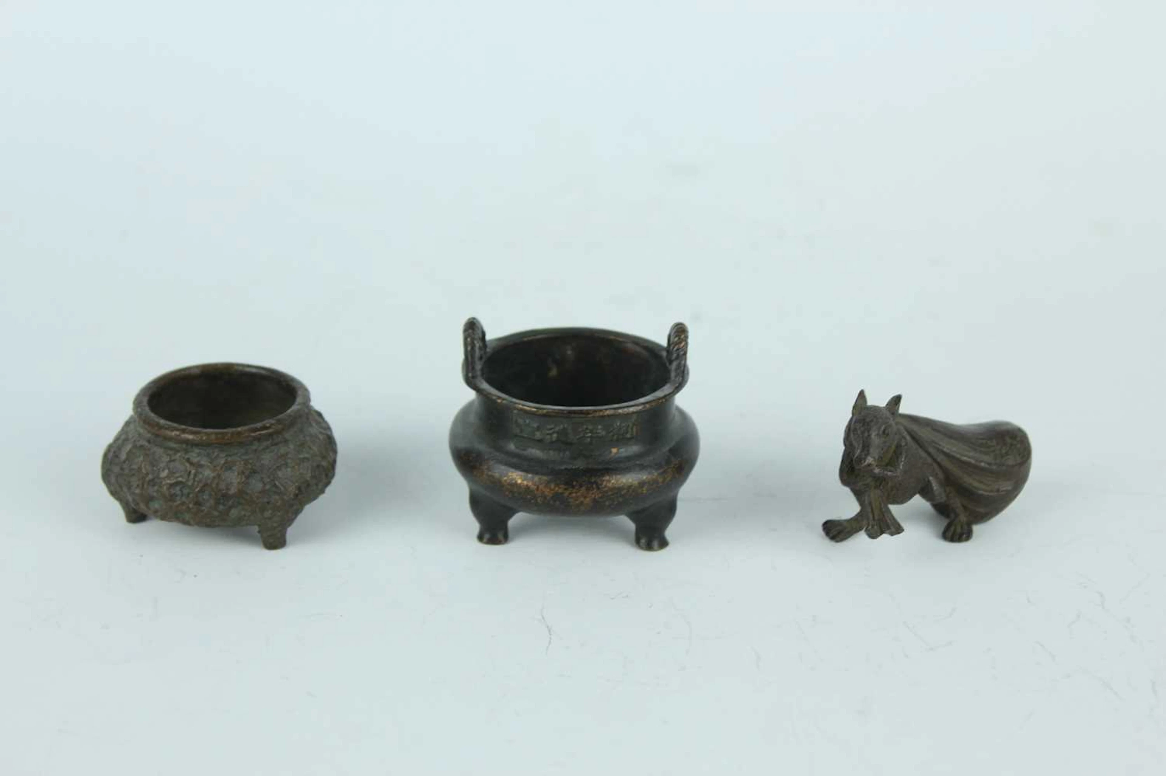 Lot 211 - A group of three Chinese and Japanese bronze