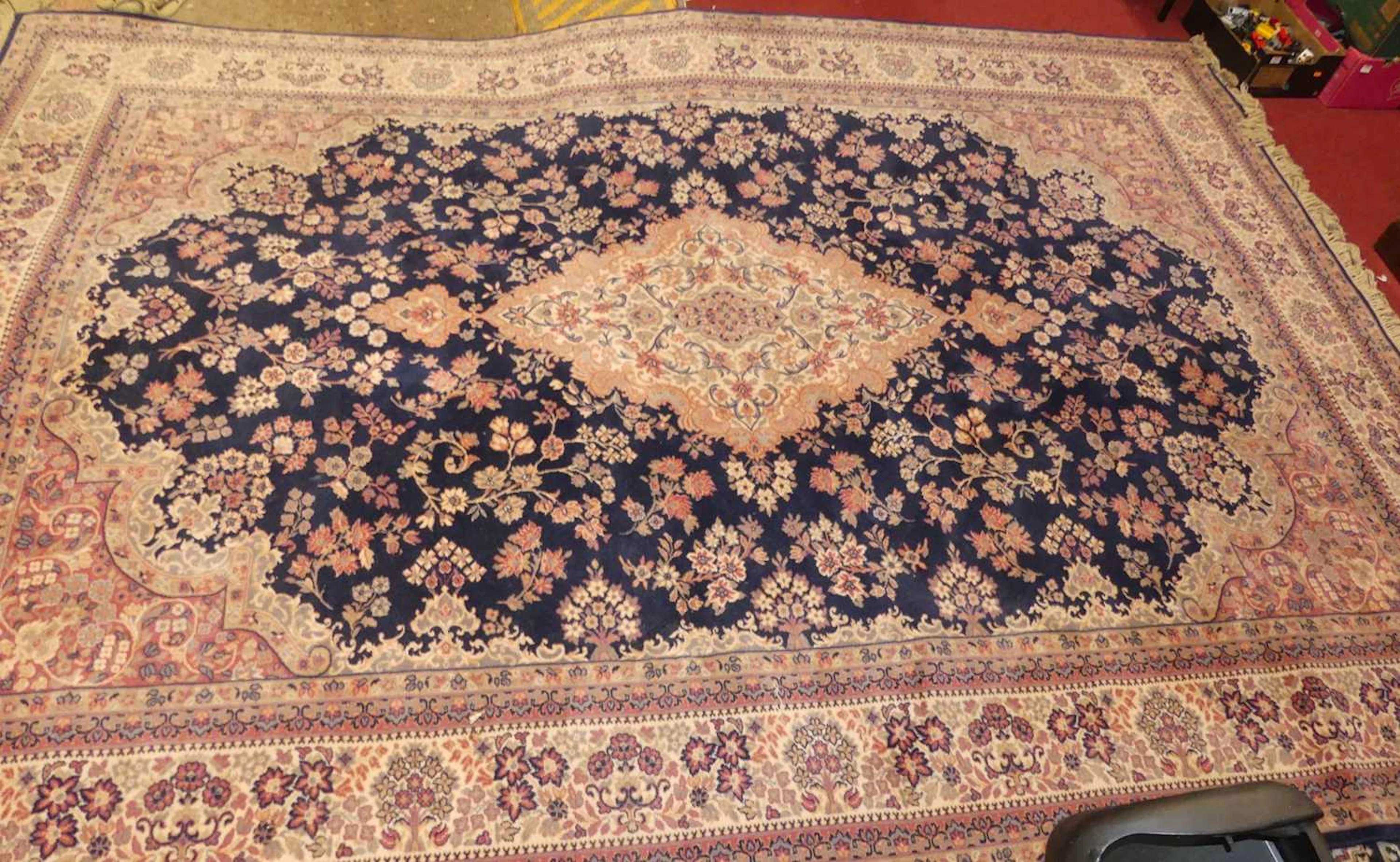 Lot 1210 - A blue, red and cream ground machine woven