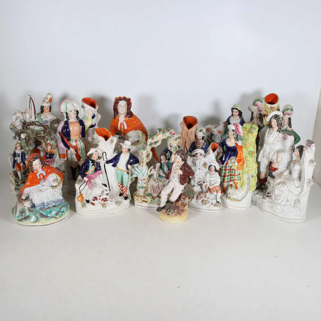 Lot 125 - A collection of Staffordshire figures, to