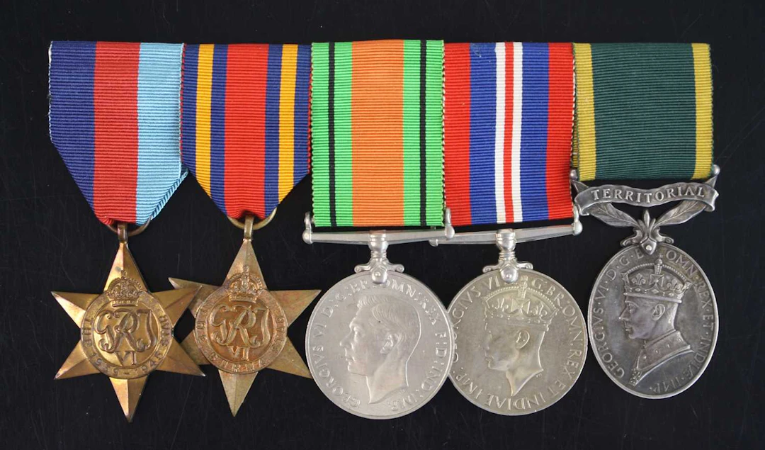 Lot 1269 - A group of five medals to include WW II