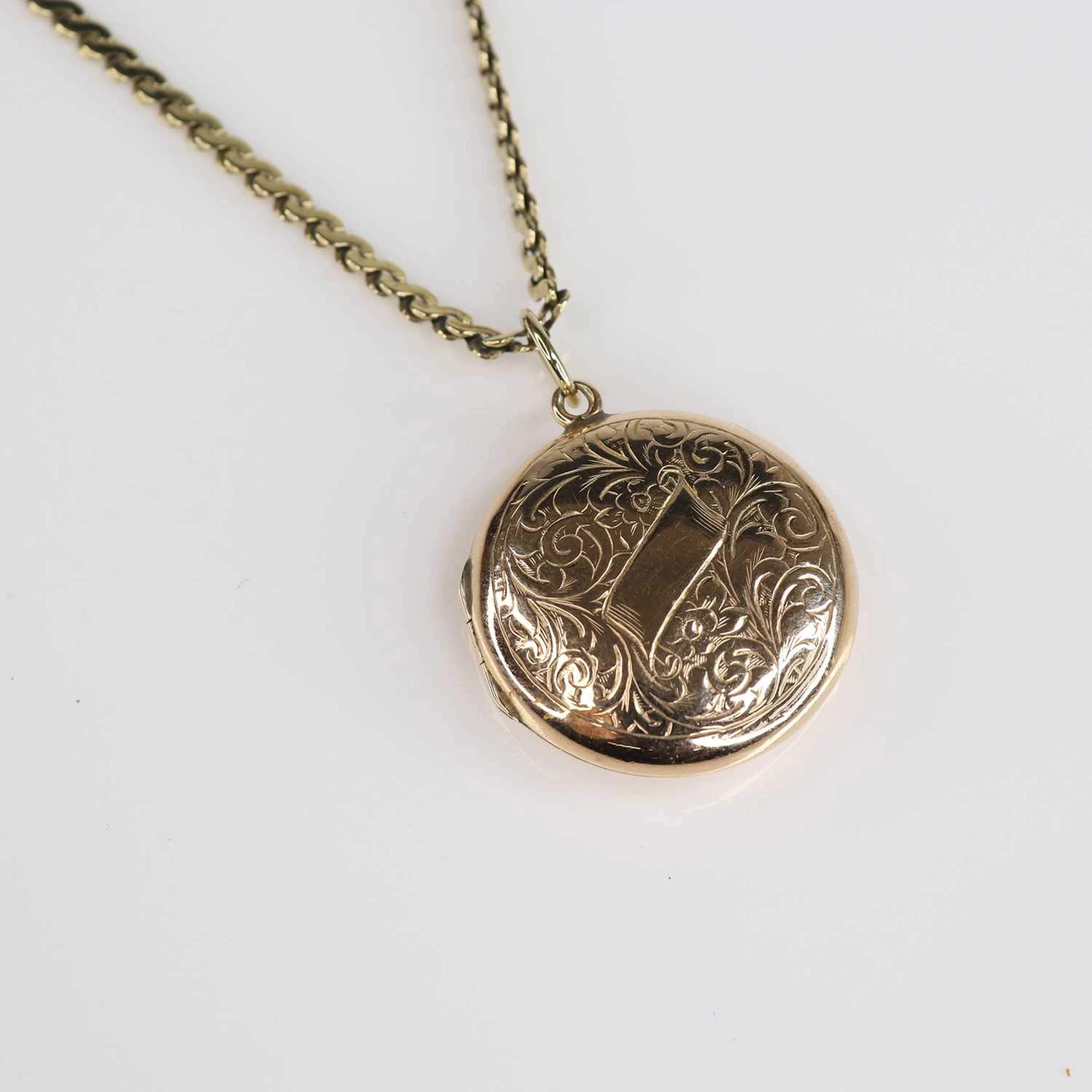 Lot 240 - A 9ct gold flat link necklace, supporting a