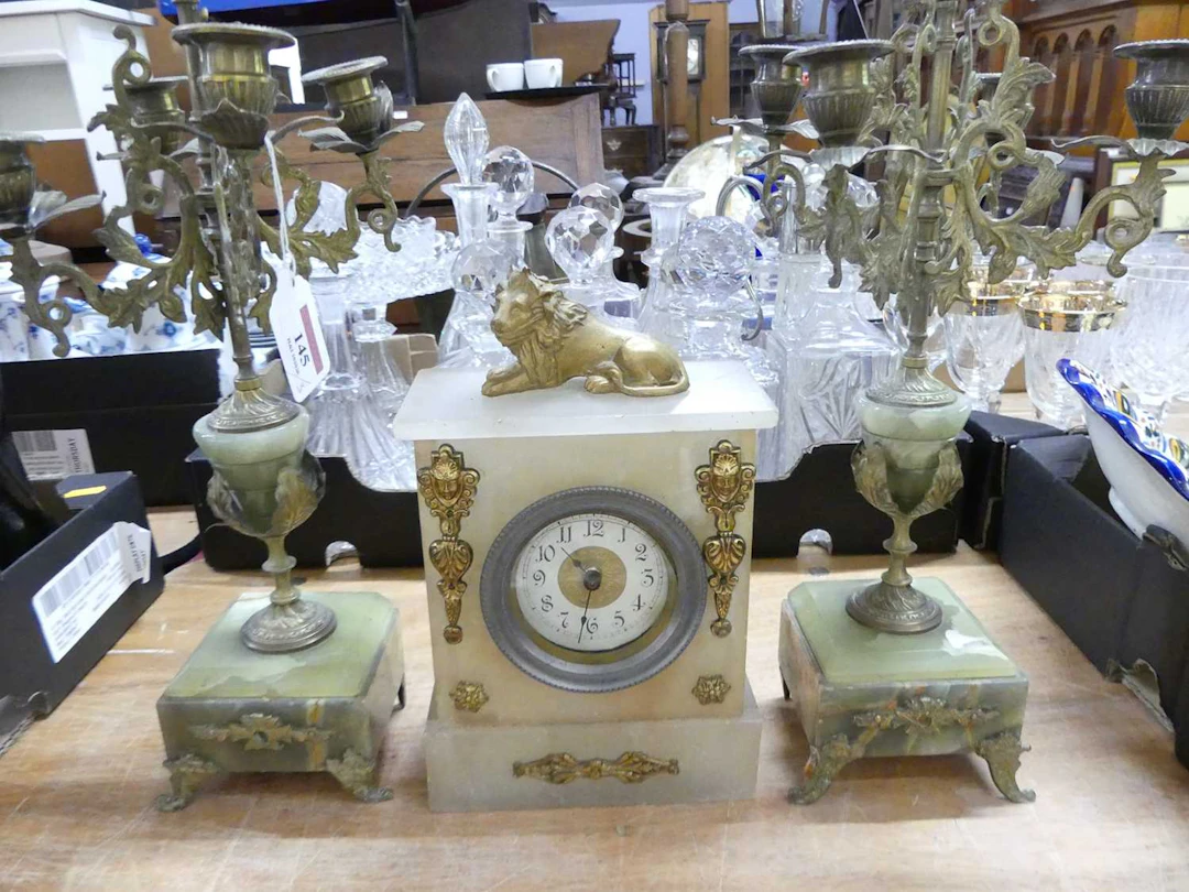 Lot 145 - A 20th century onyx cased mantel clock