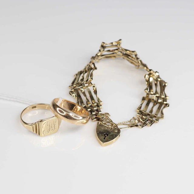 Lot 225 - Two rings, being a yellow metal square