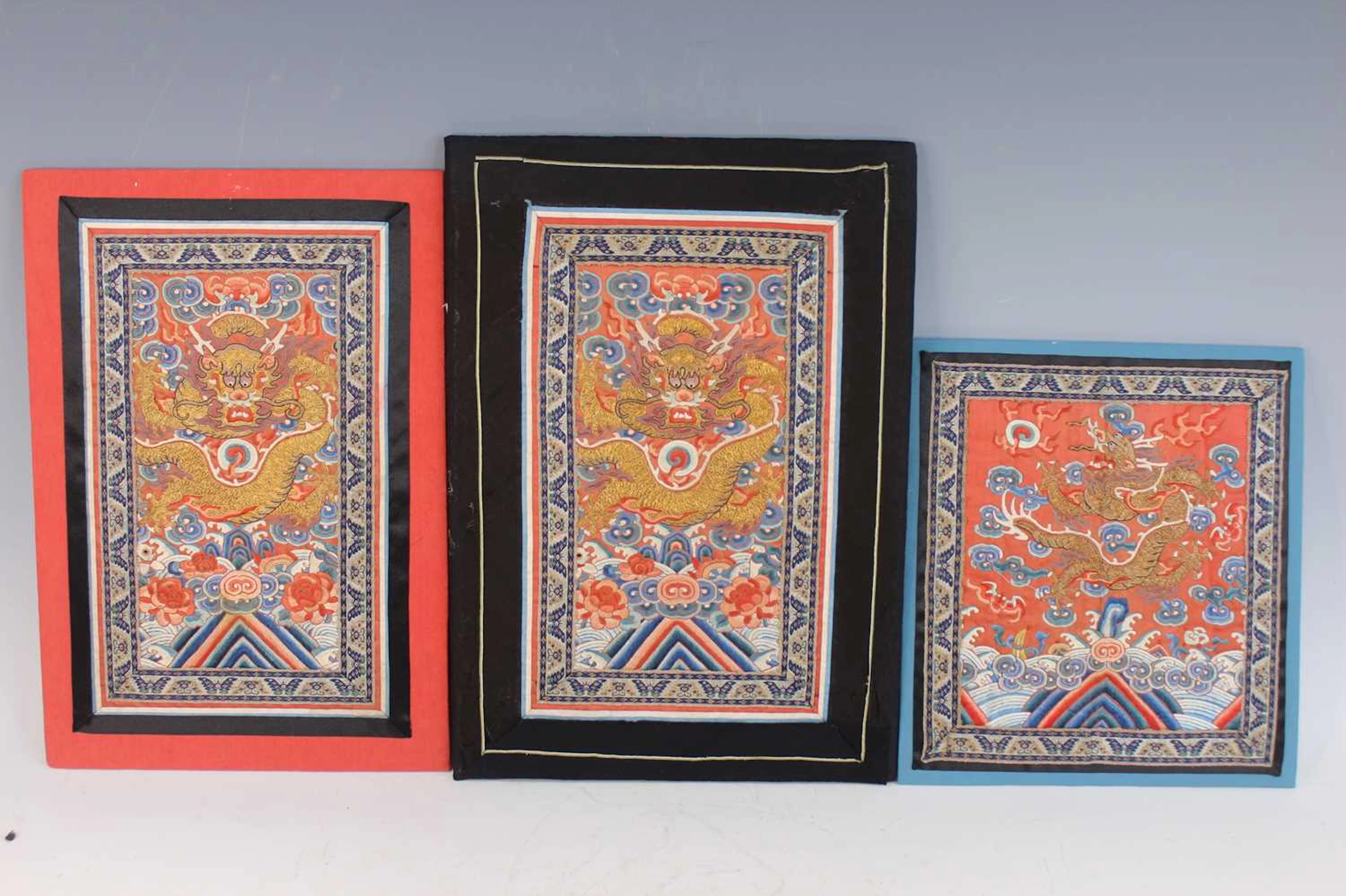 Lot 99 - Three Chinese embroidered silk dragon panels