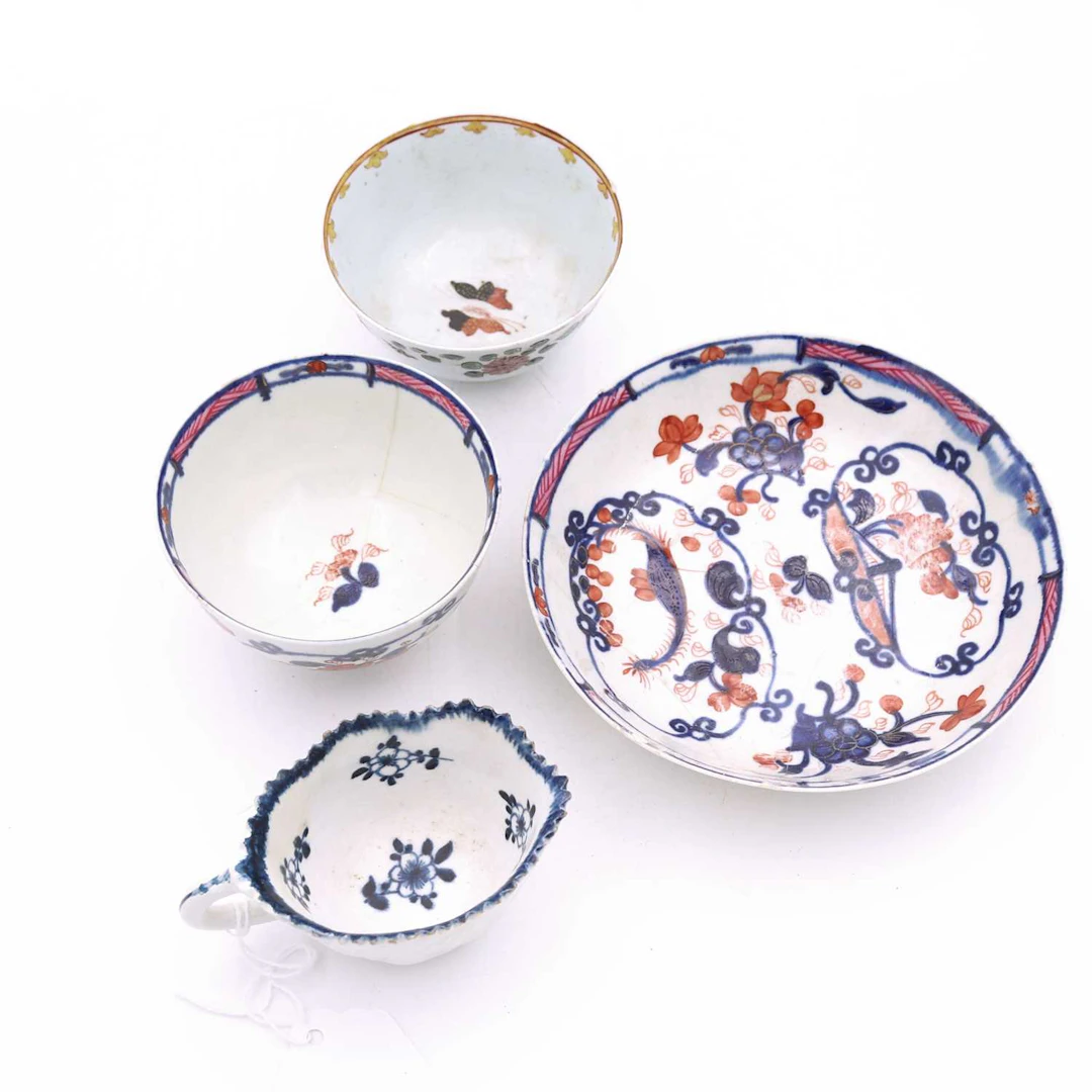 Lot 105 - A Liverpool porcelain moulded butter boat