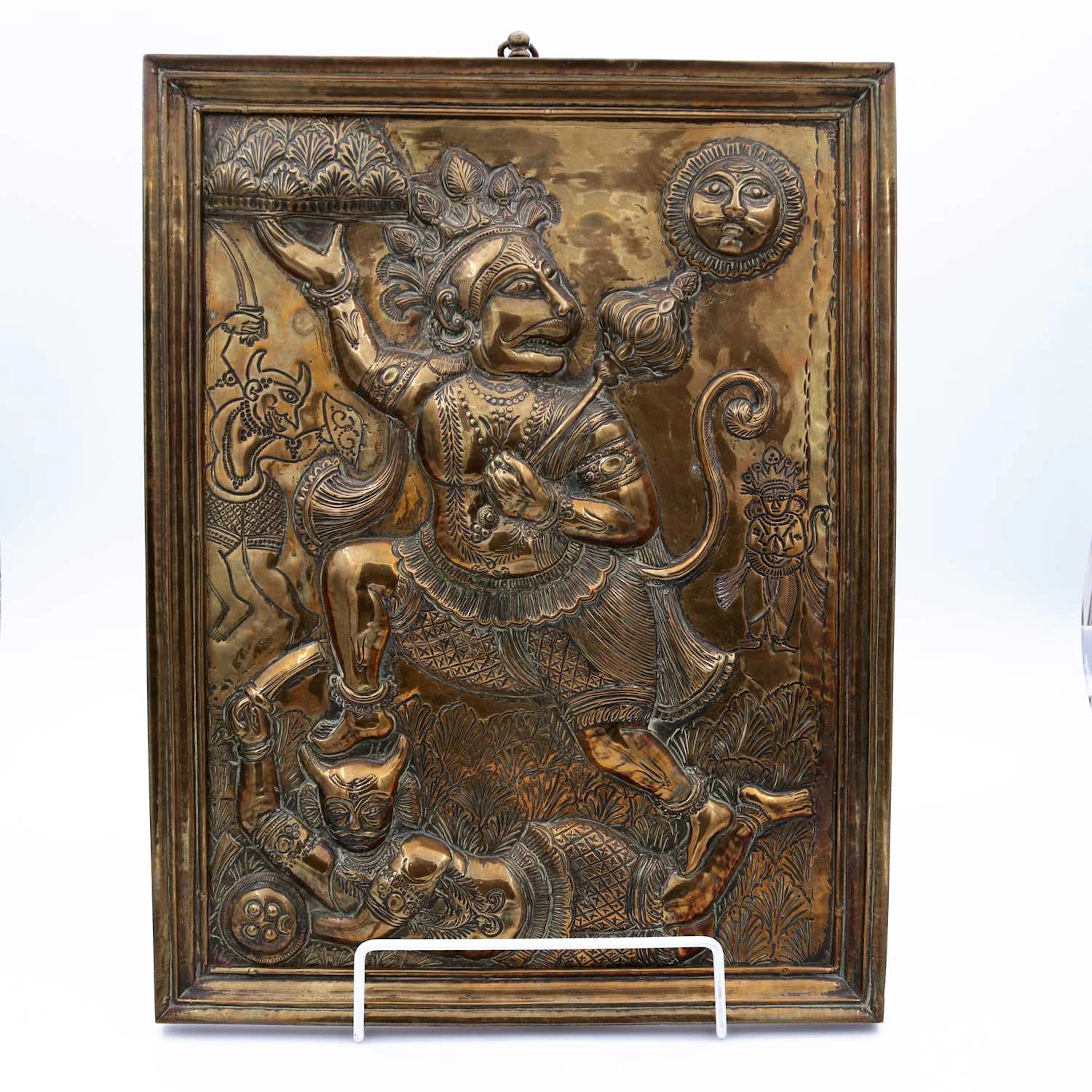 Lot 6 - An Indian brass devotional panel, repousse