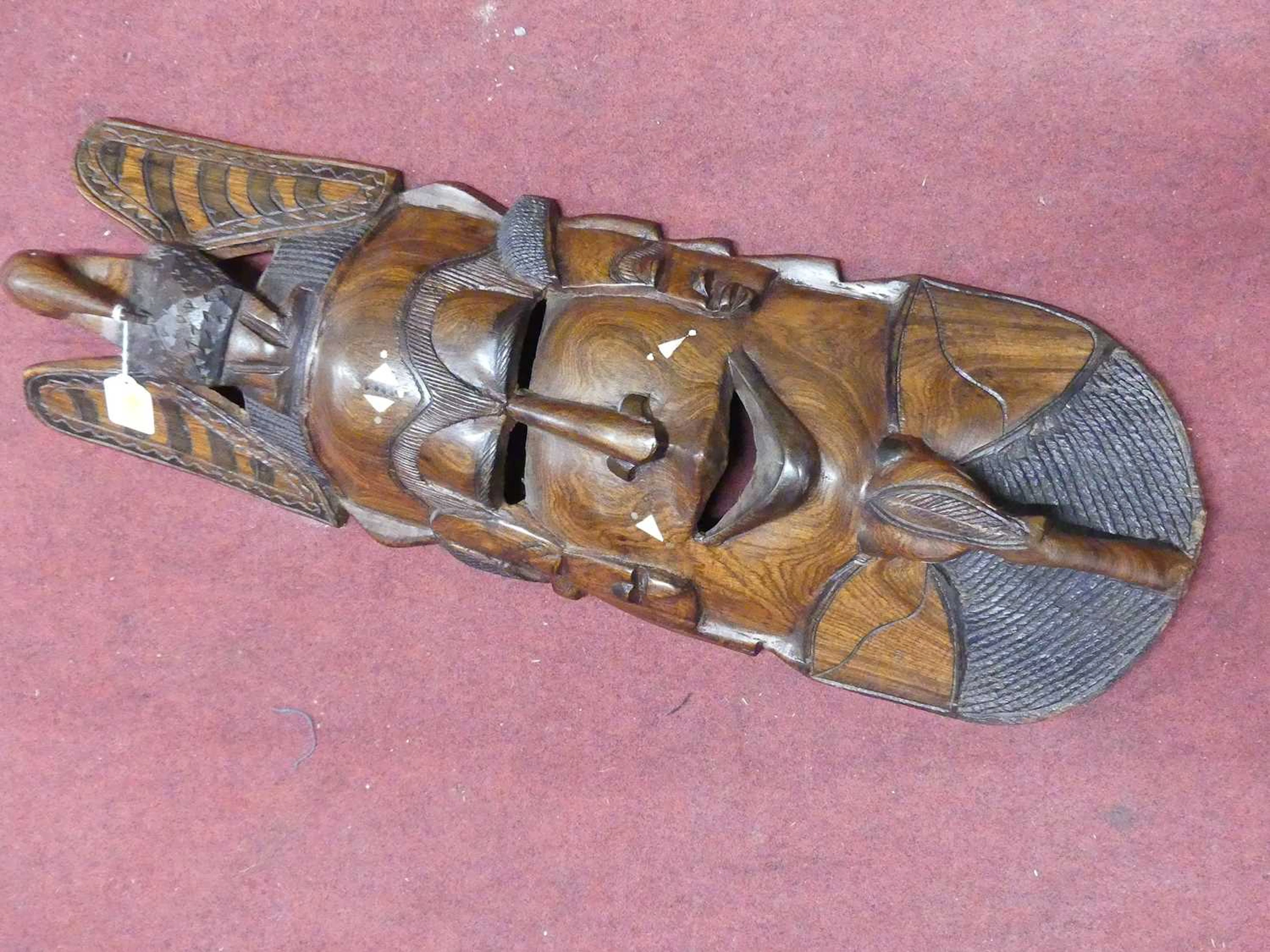 Lot 84 - A tribal carved hardwood mask, h.75cm