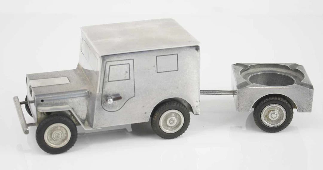 Lot 1263 - A novelty table lighter in the form of a