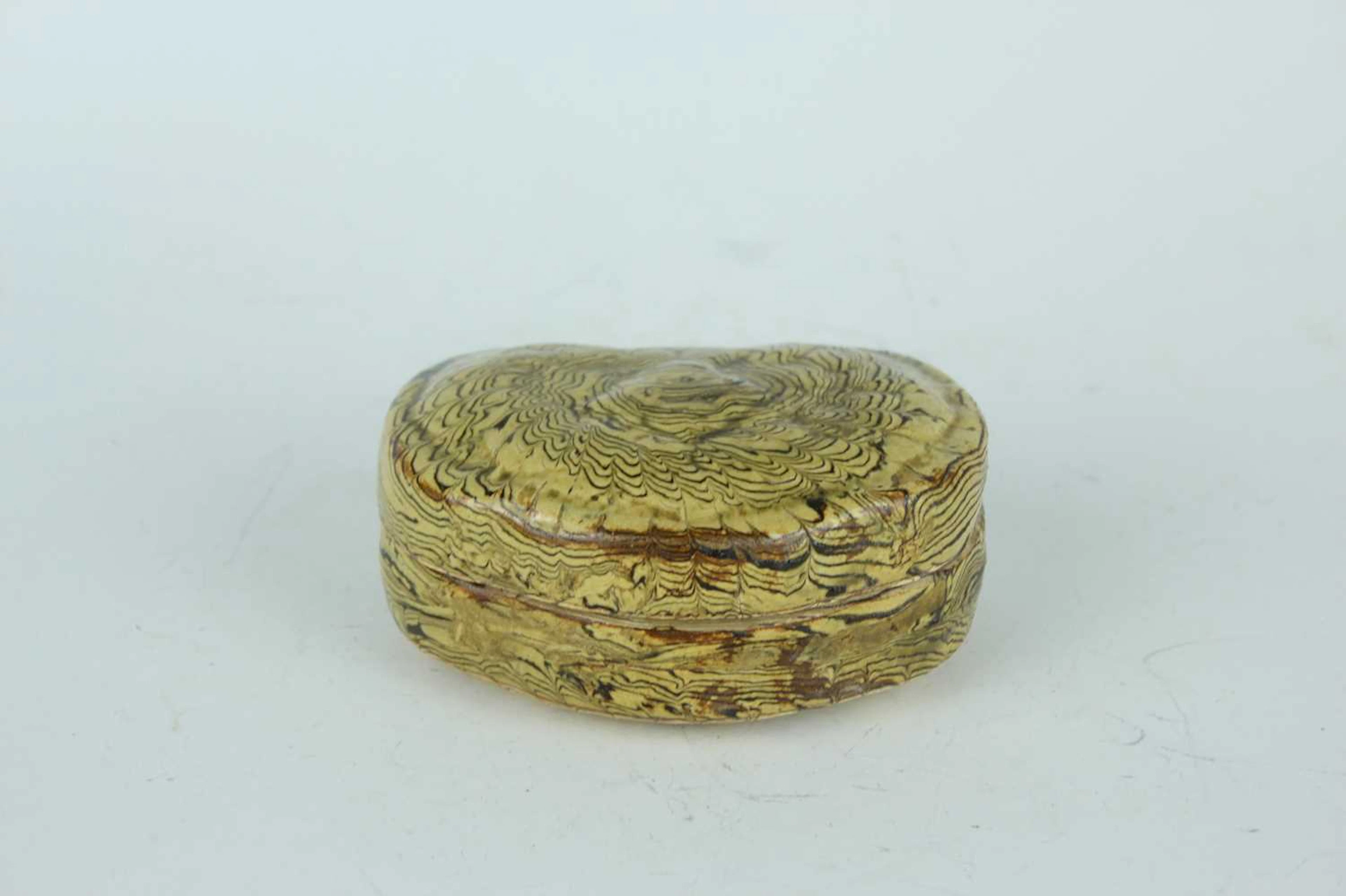 Lot 66 - A Chinese kidney-shaped marbled pottery box