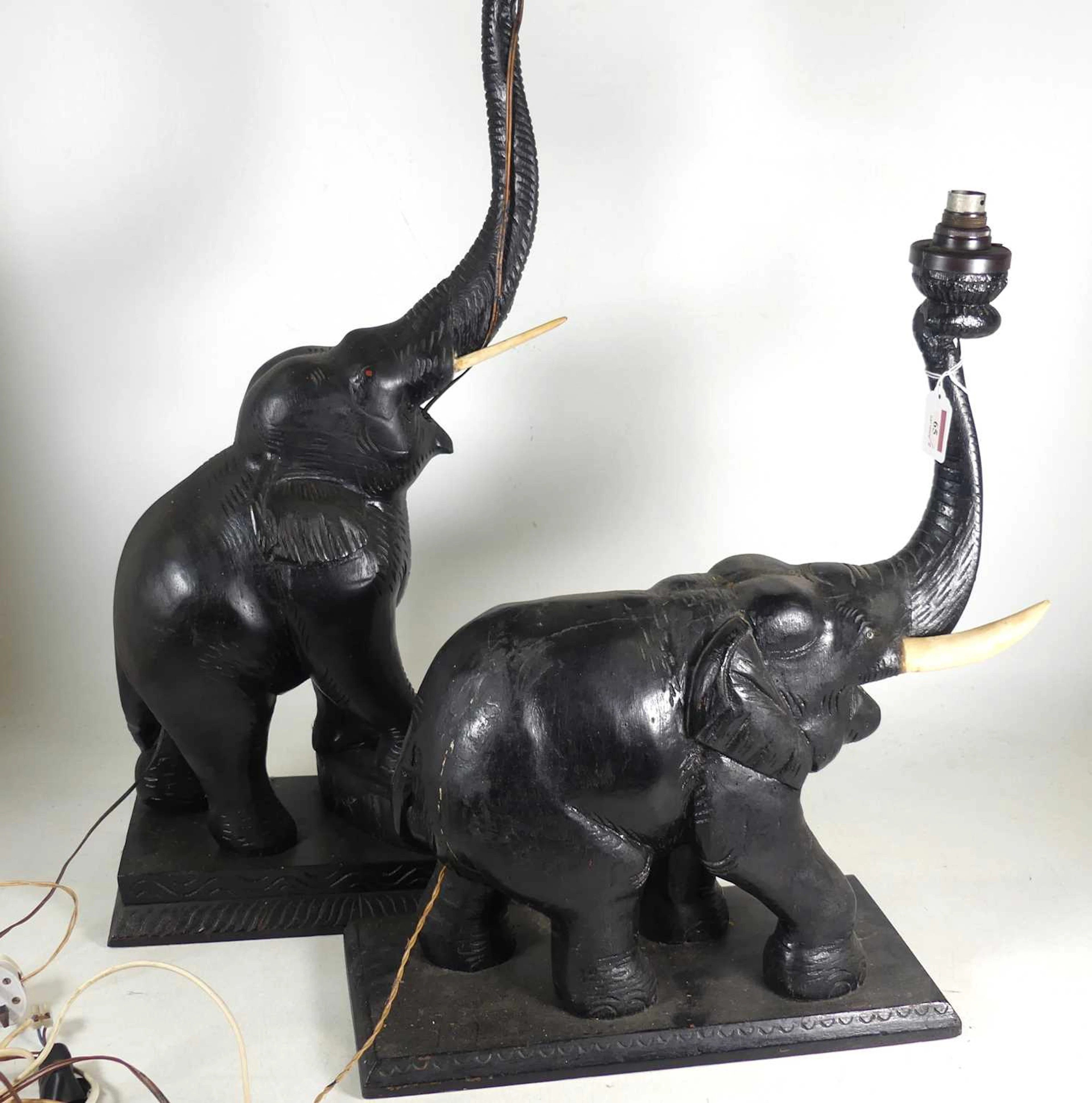 Lot 65 - A 20th century carved hardwood table lamp in