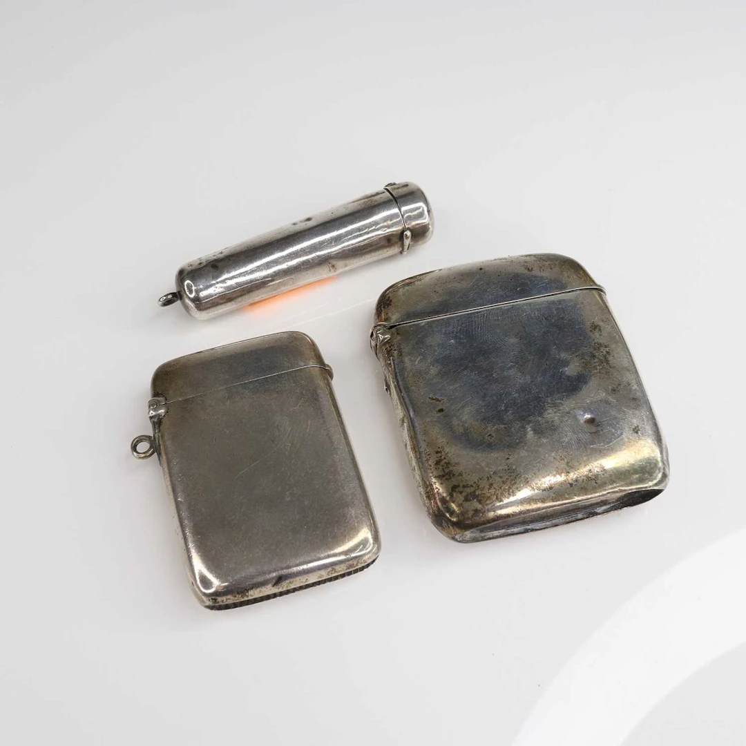 Lot 206 - Two plain silver vesta cases, together with