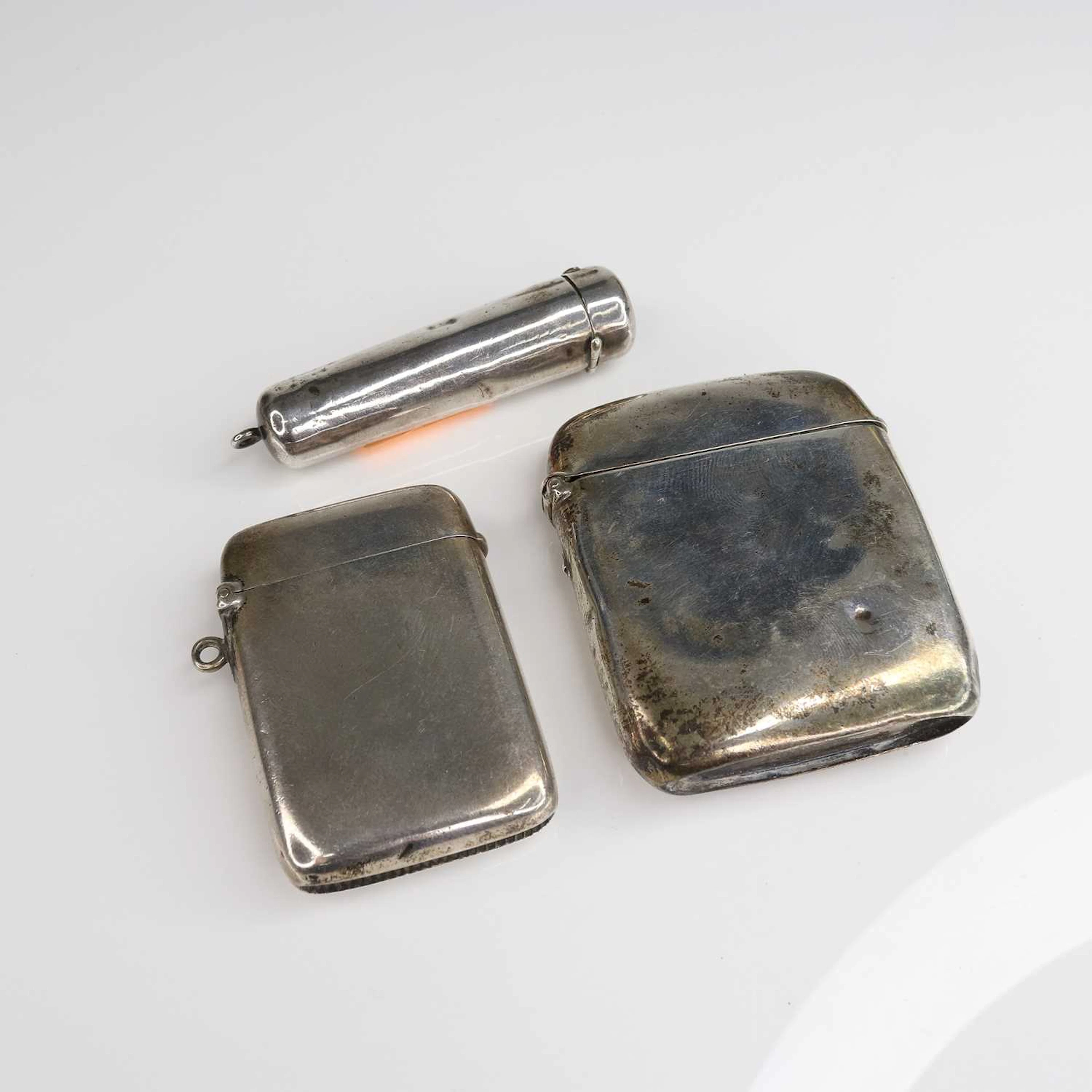 Lot 206 - Two plain silver vesta cases, together with