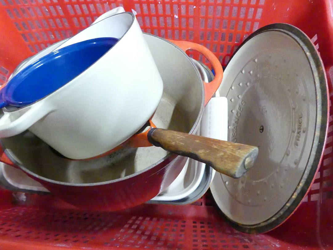 Lot 81 - A collection of enamelled cast iron cookware