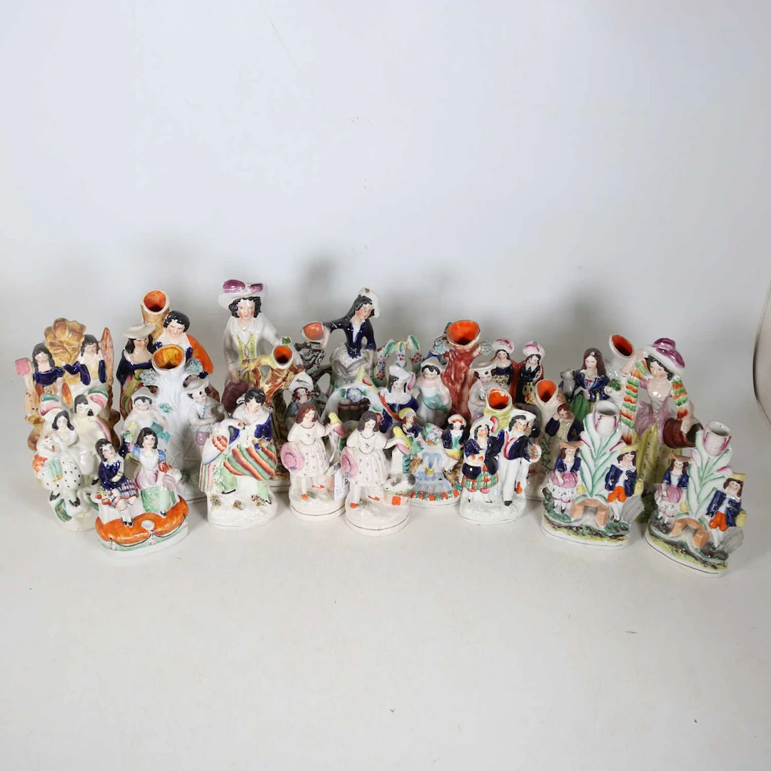 Lot 128 - A collection of Staffordshire figures, to