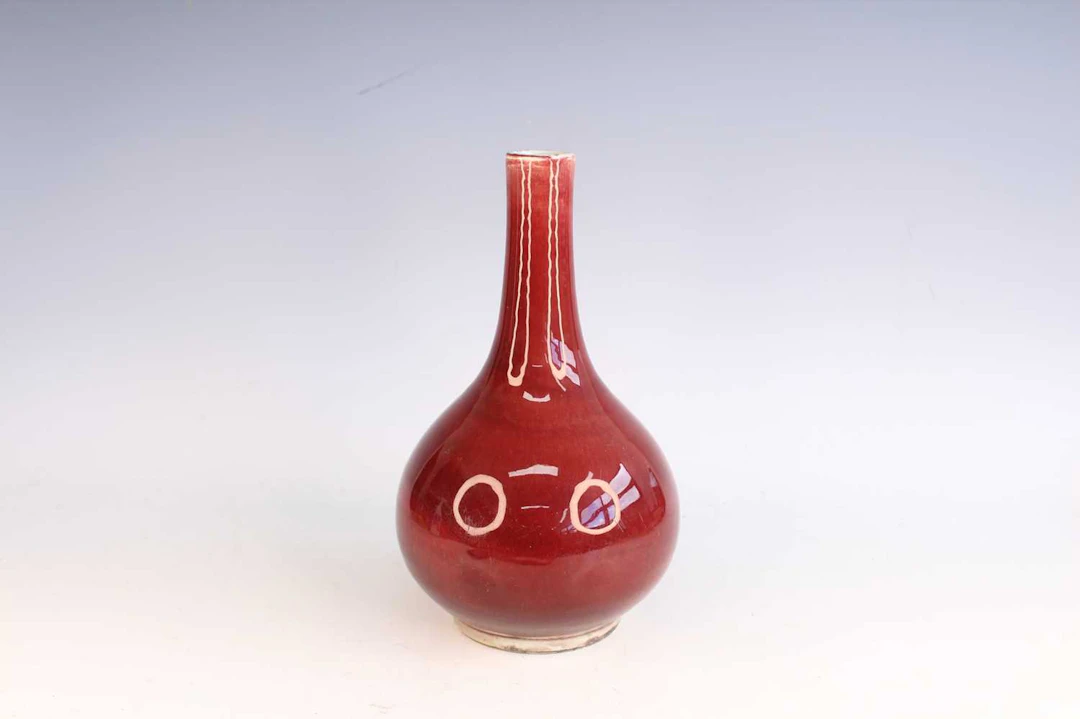 Lot 73 - A Chinese copper-red glazed bottle vase, Qing