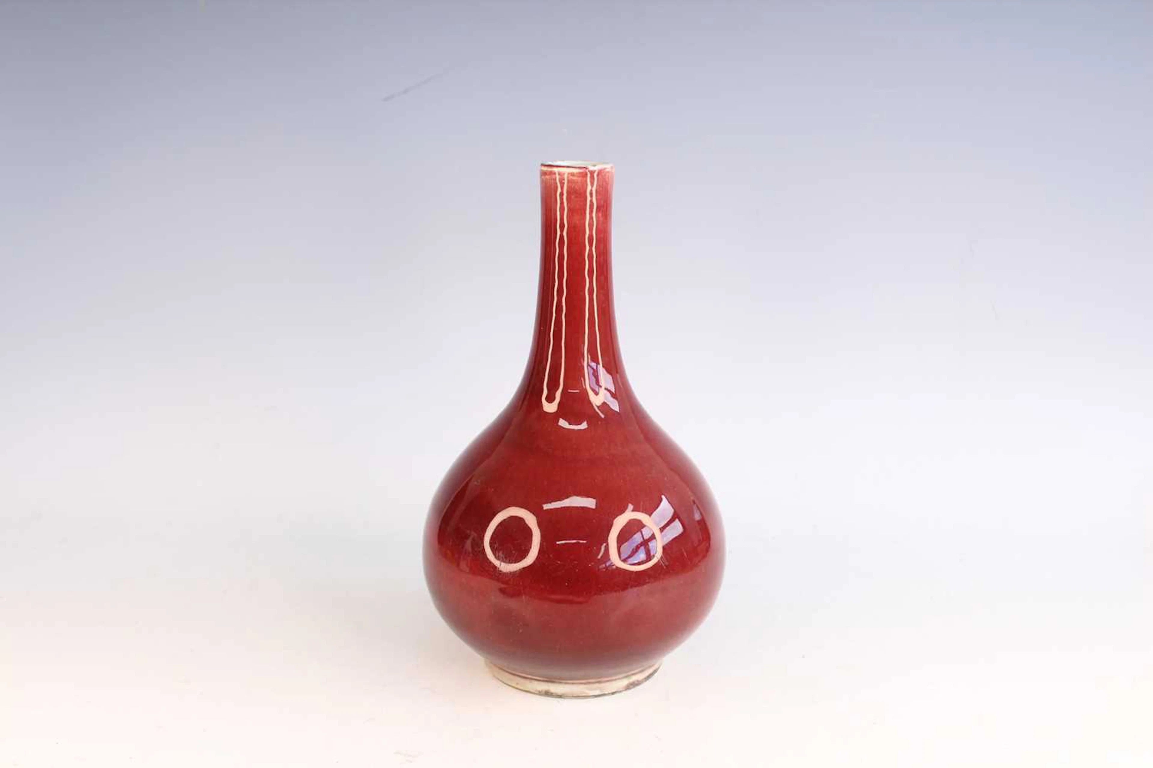 Lot 73 - A Chinese copper-red glazed bottle vase, Qing