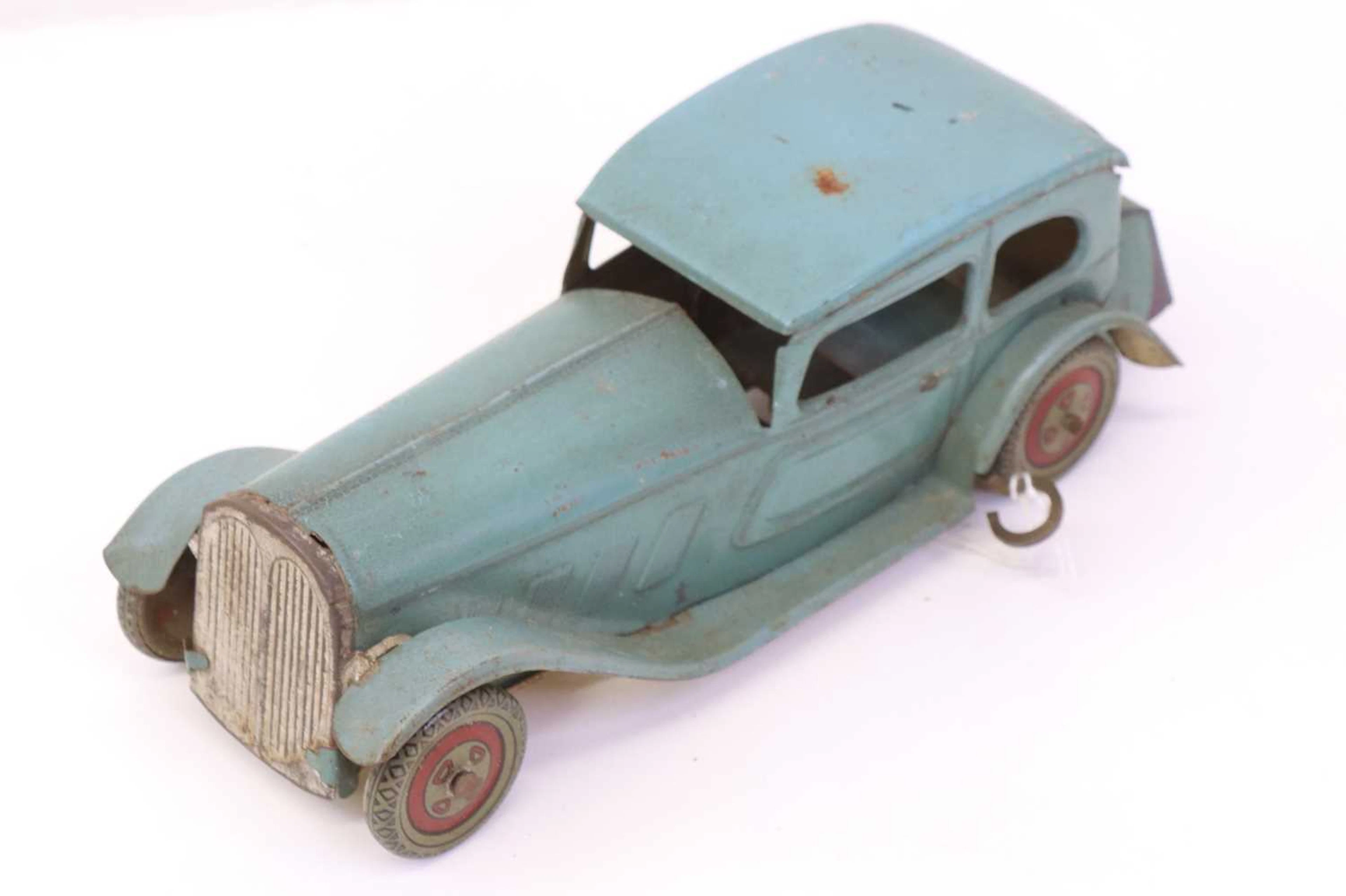 Lot 68 - Wells Tinplate Clockwork model of a saloon