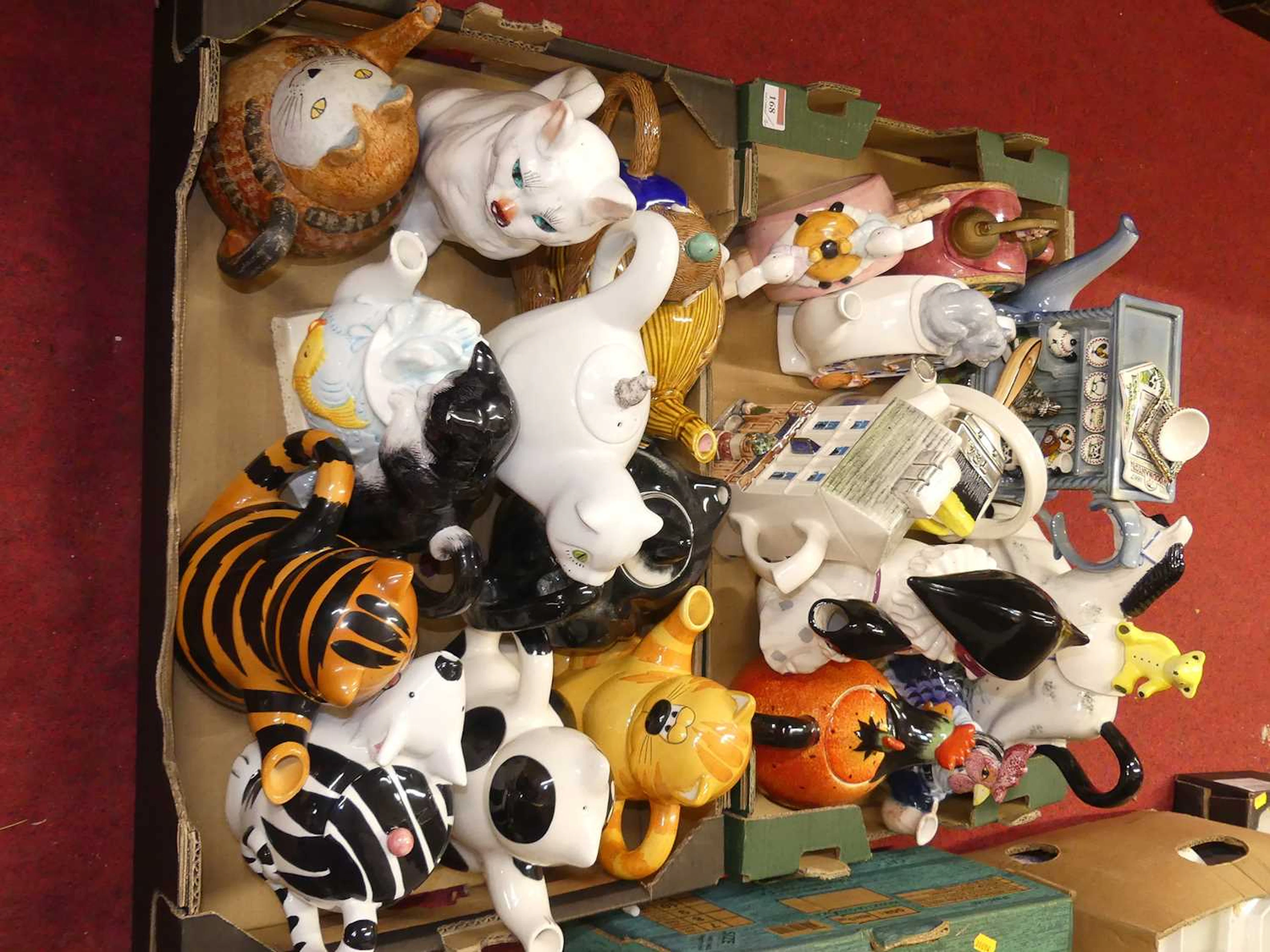 Lot 168 - A collection of novelty teapots, to include