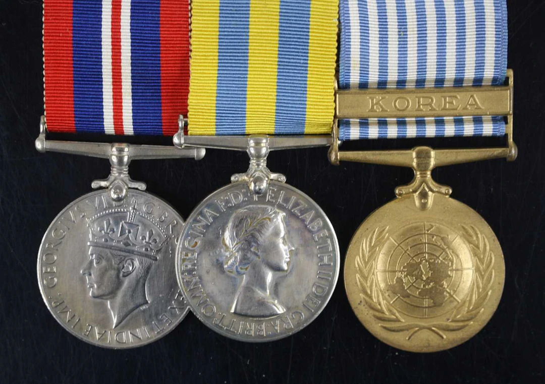 Lot 1222 - A group of three medals to include WW II