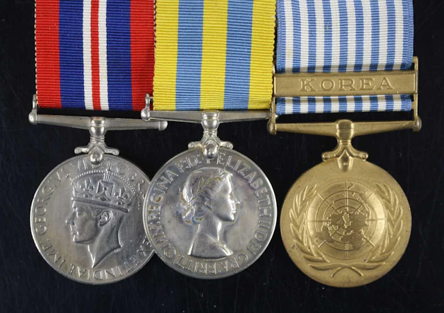 Lot 1222 - A group of three medals to include WW II