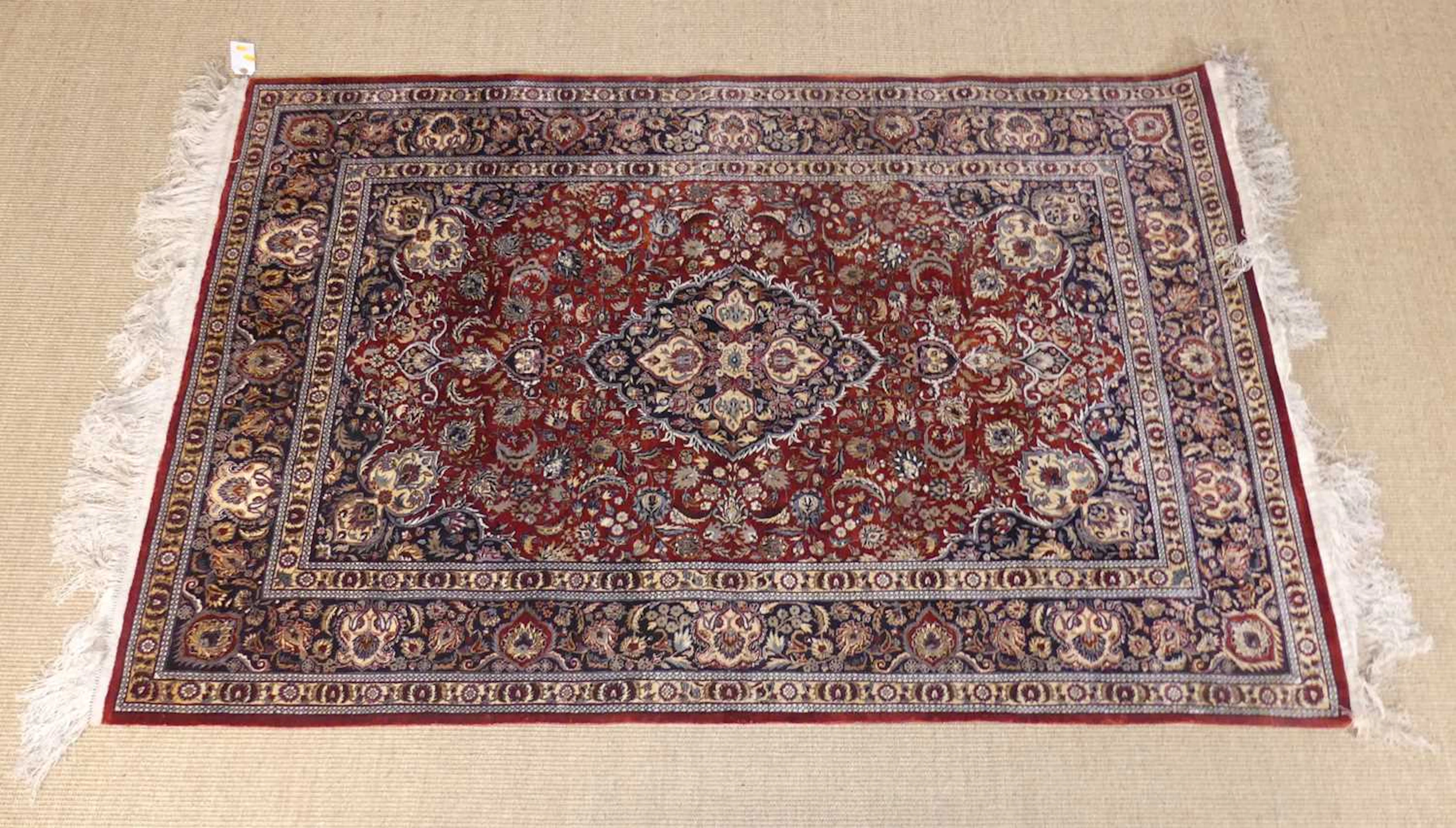 Lot 236 - A Persian woven silk Kashan rug, having a