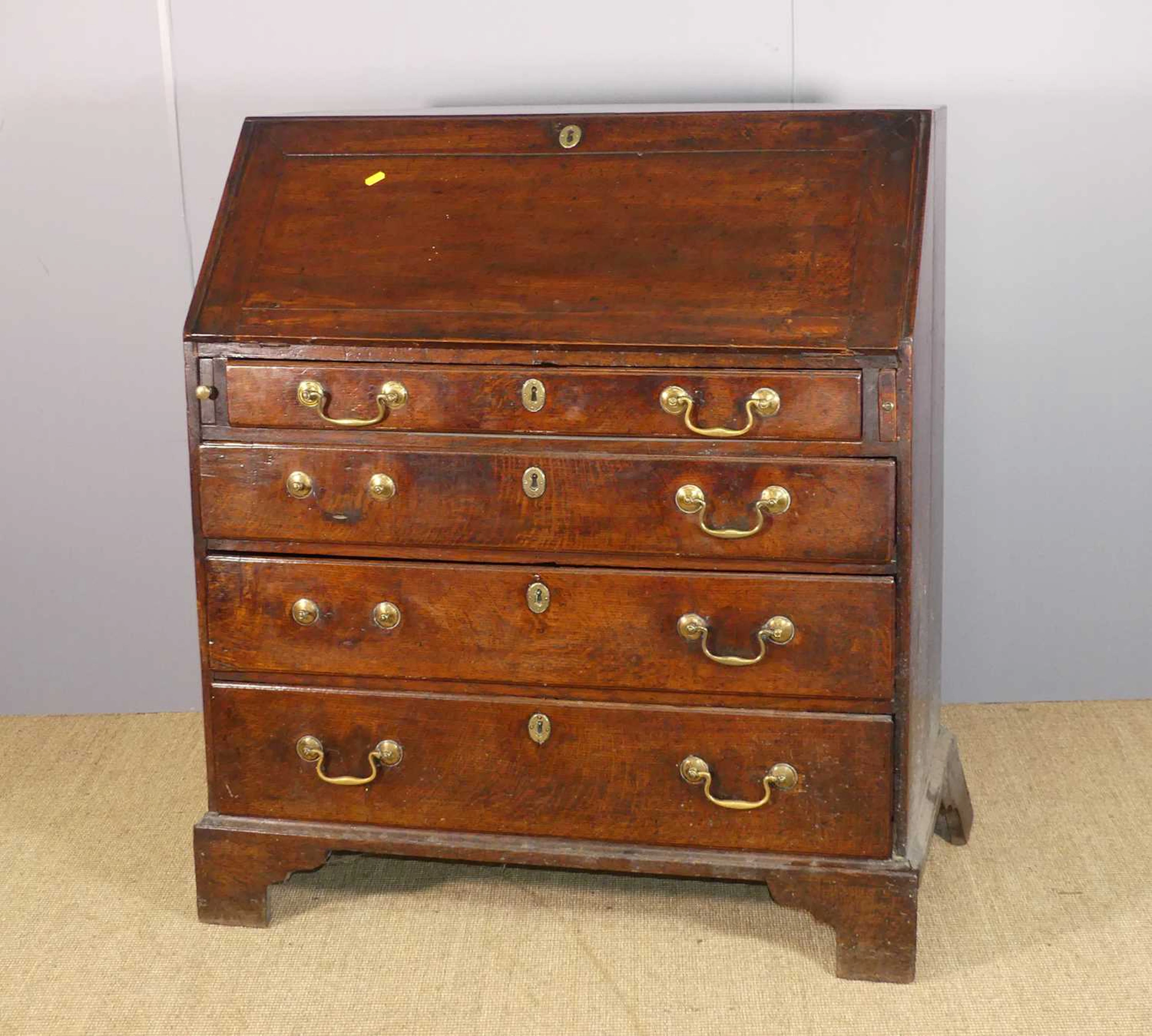 Lot 646 - A circa 1800 provincial oak slope front four-
