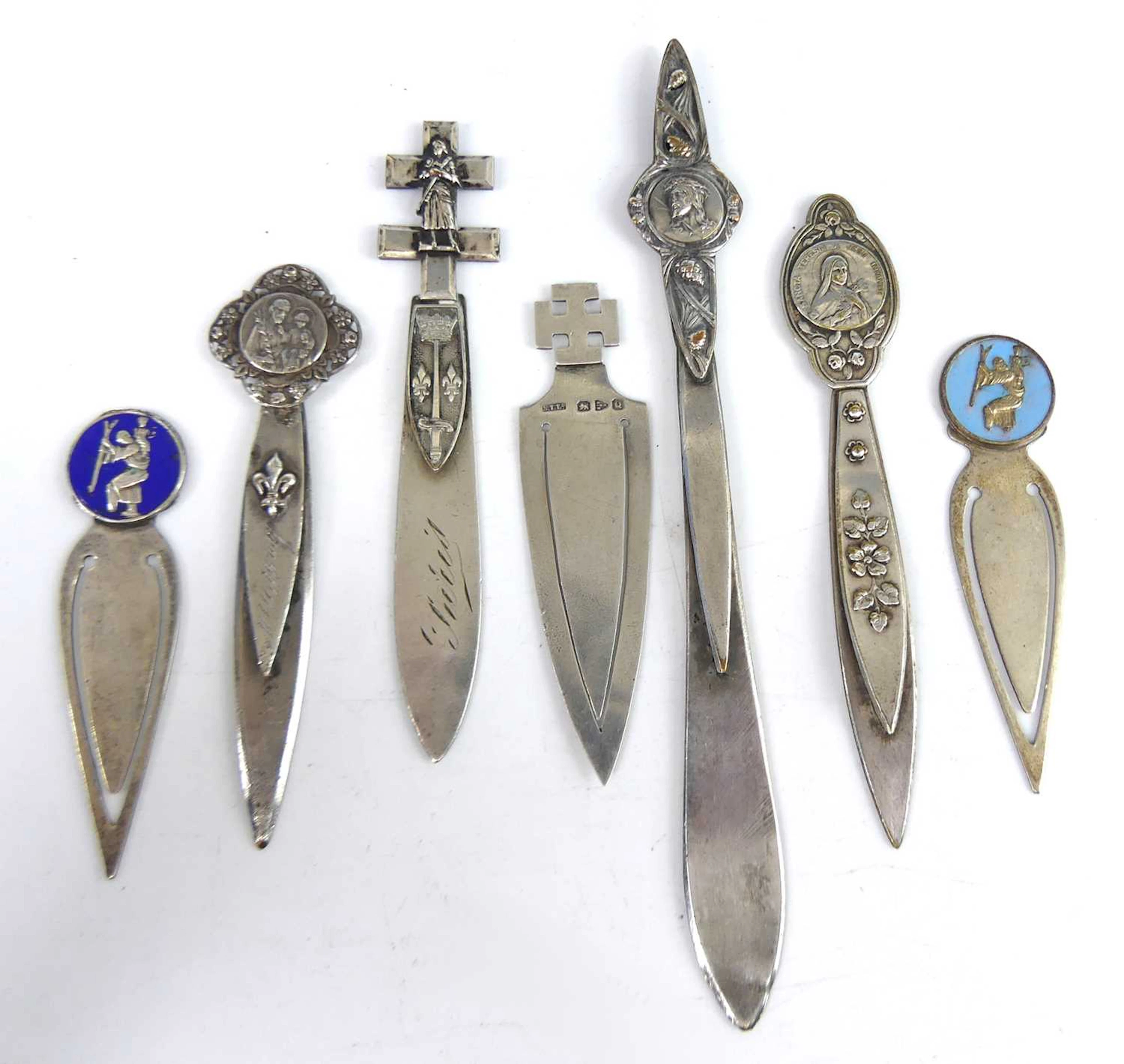 Lot 18 - A late Victorian silver clip bookmark topped
