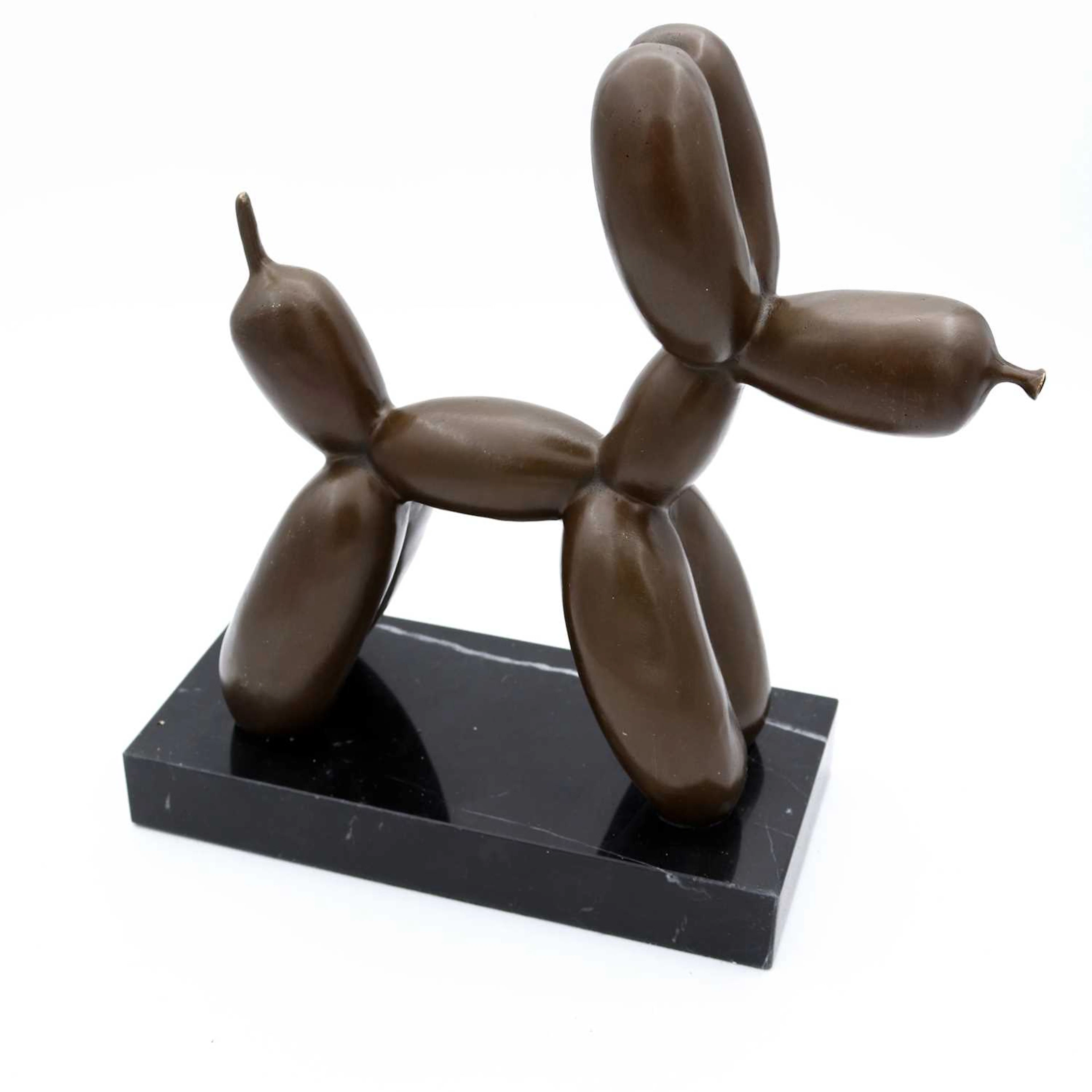 Lot 18 - A reproduction bronzed metal figure of a dog