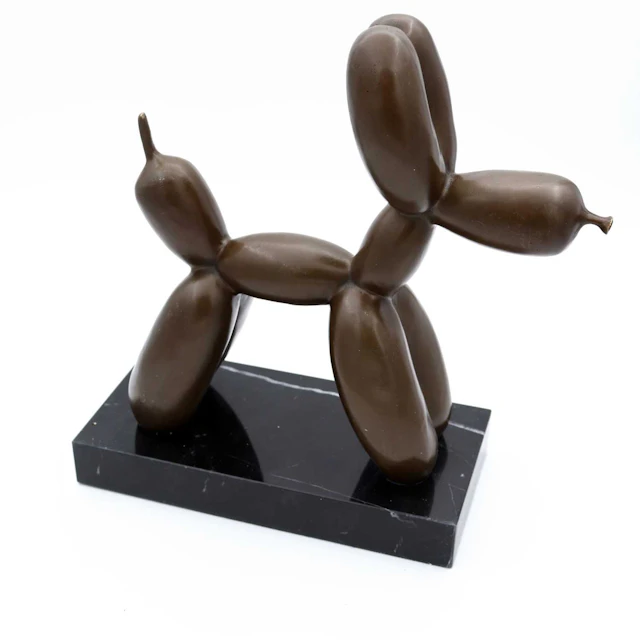 Lot 18 - A reproduction bronzed metal figure of a dog