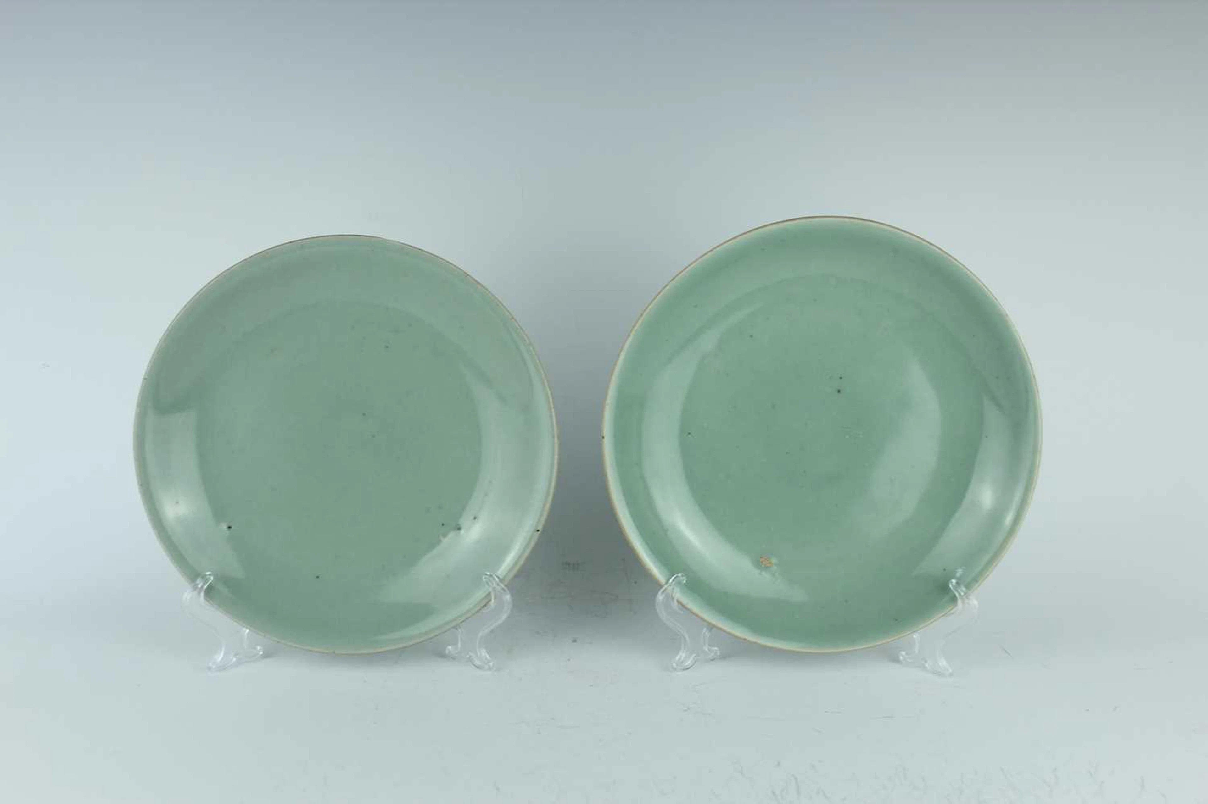 Lot 65 - A pair of Chinese celadon-glazed dishes, Qing