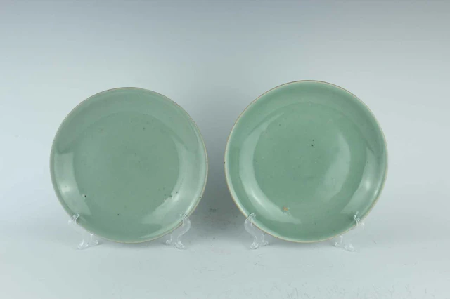 Lot 65 - A pair of Chinese celadon-glazed dishes, Qing