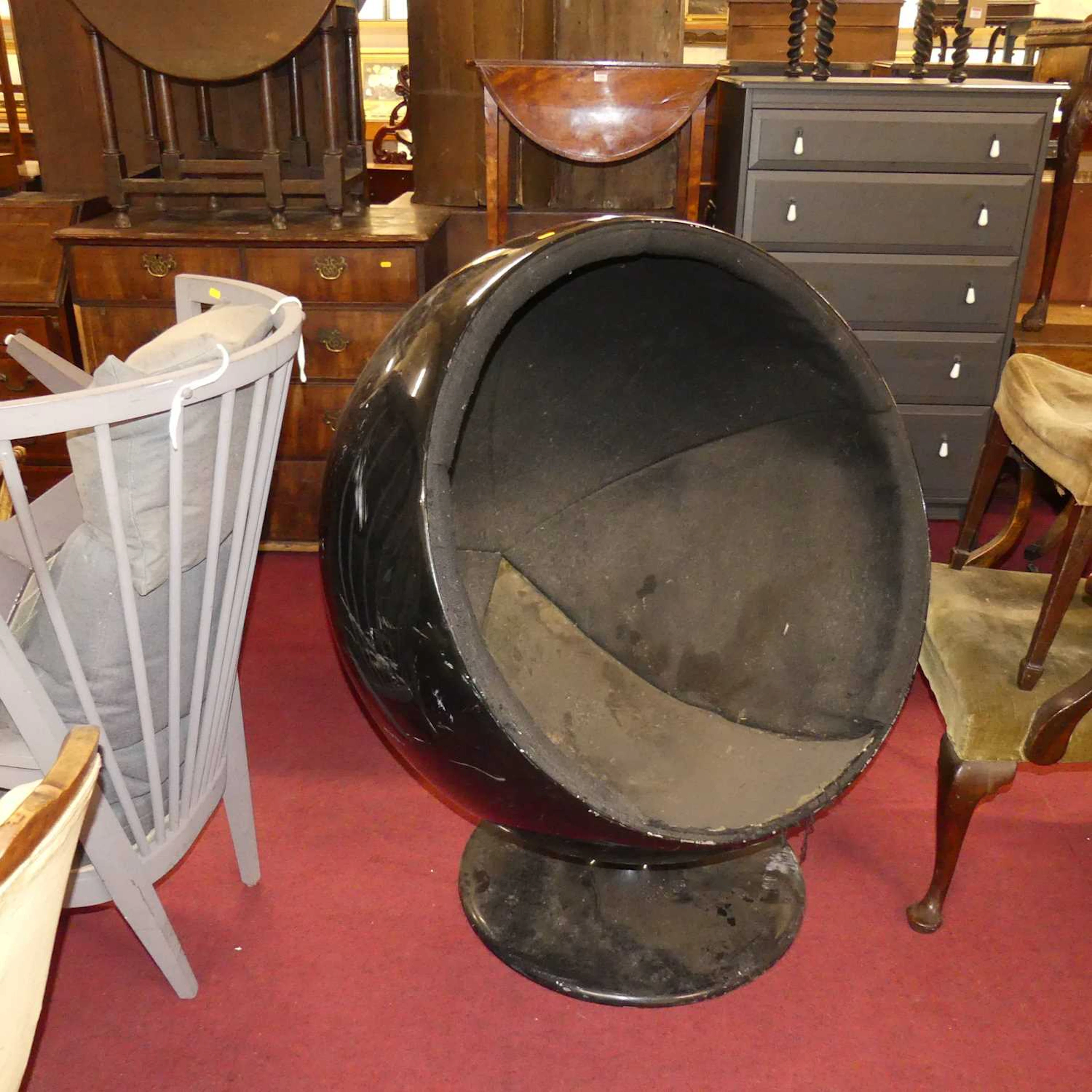 Lot 1310 - After Eero Aarnio, a black lacquered