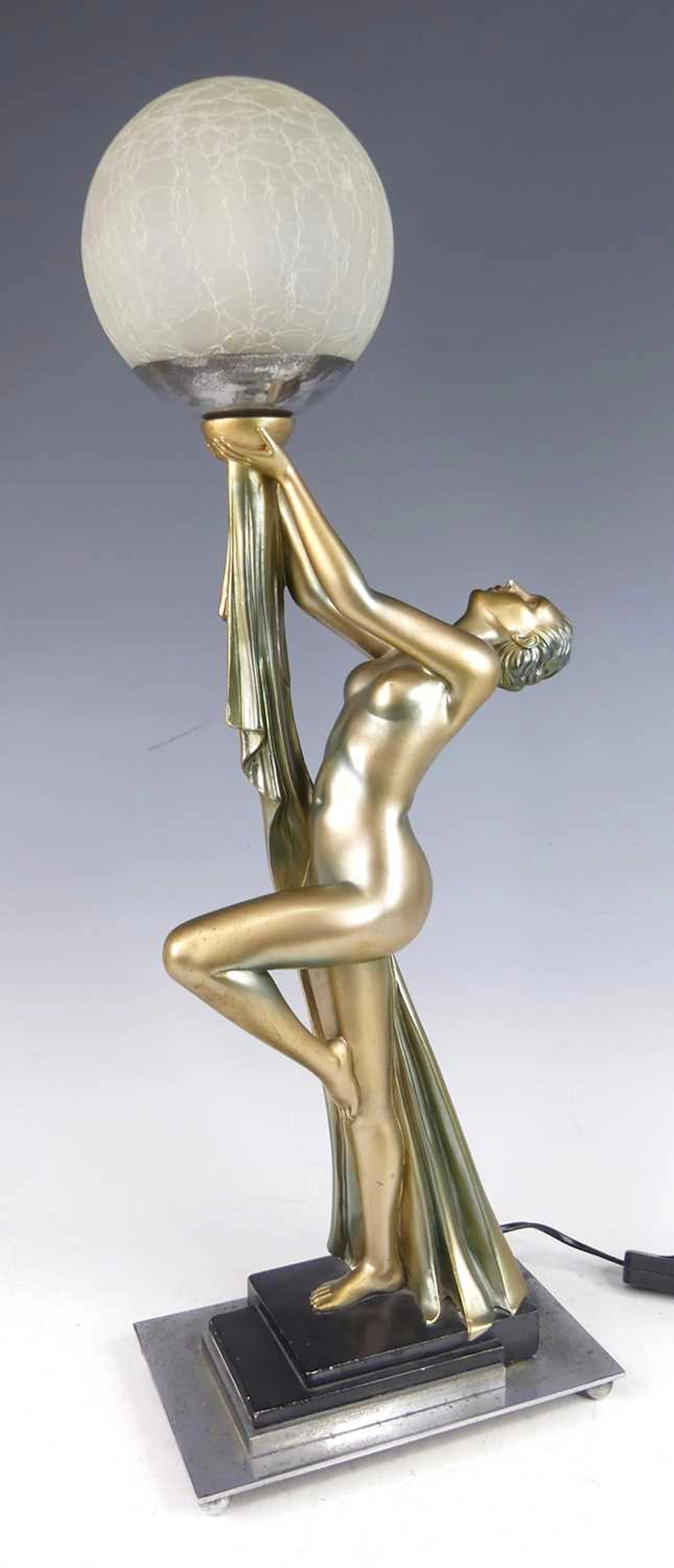 Lot 193 - An Art Deco patinated plaster table lamp