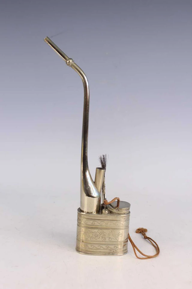 Lot 39 - A Chinese engraved white metal water pipe