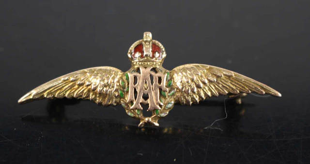 Lot 1069 - A WW II yellow metal and enamelled RAF