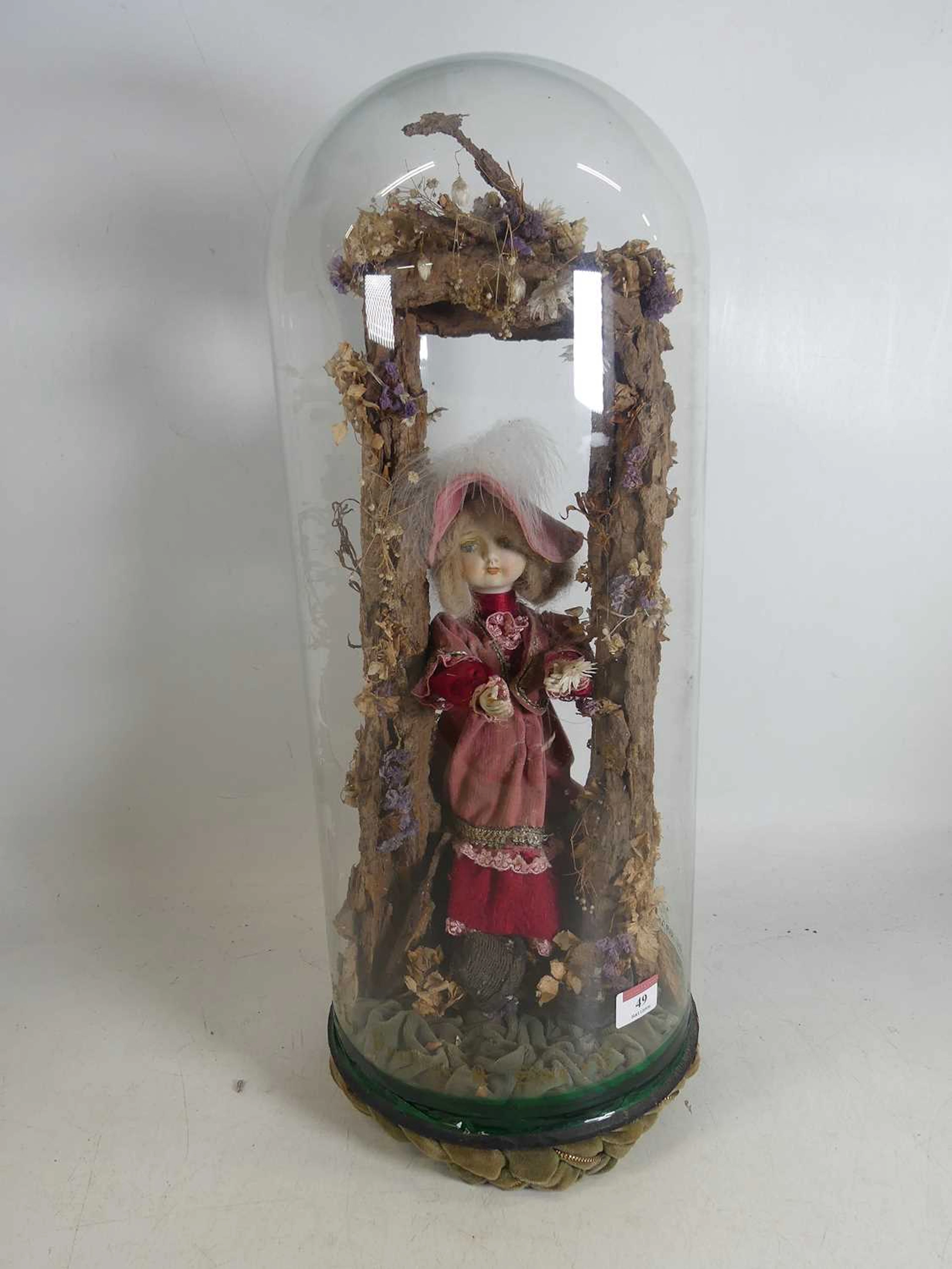 Lot 49 - An early 20th century French doll, housed