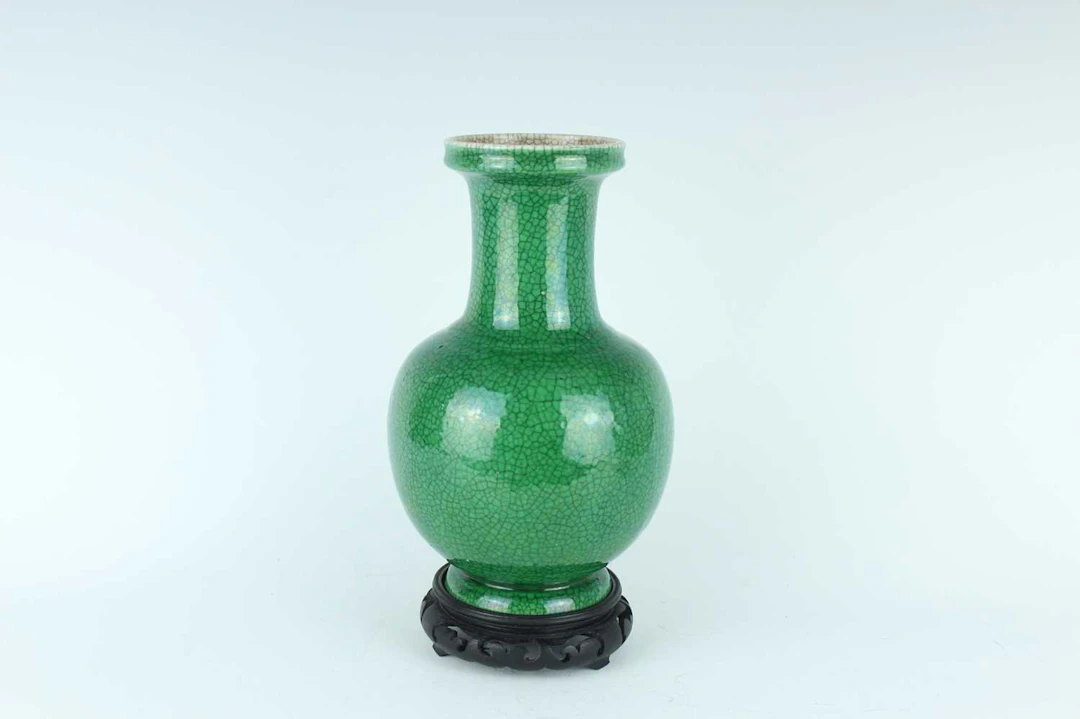 Lot 76 - A Chinese green crackle-glazed bottle vase